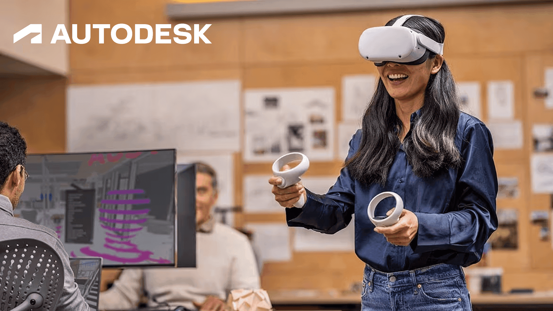 A professional designer using a VR headset and motion controllers to interact with a complex 3D architectural model within an Autodesk immersive design review environment.
