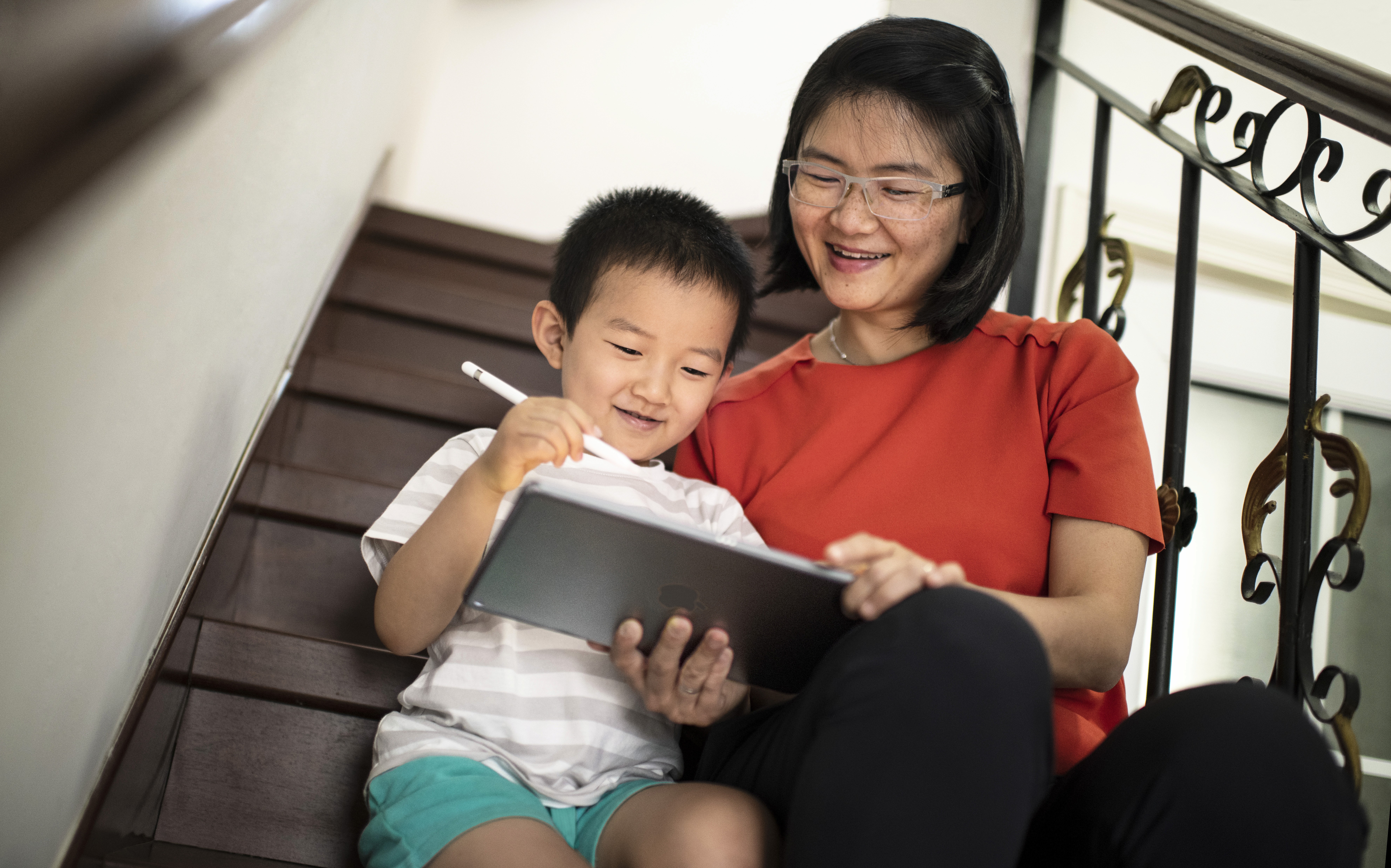 man using silver iPad