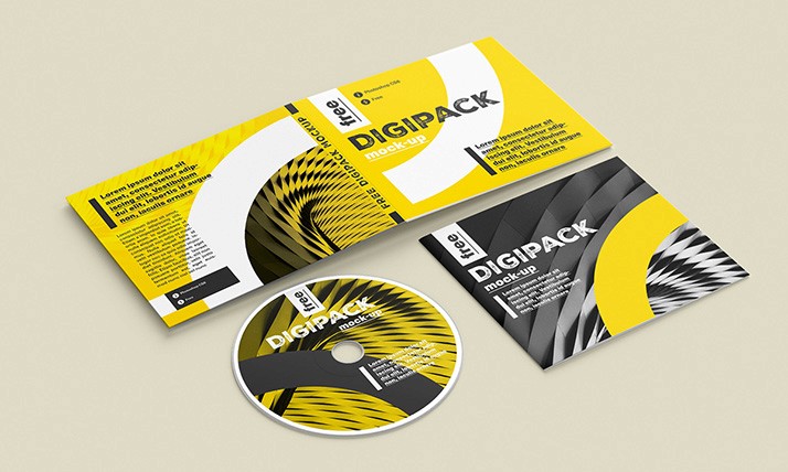 CD digipack with a modern design featuring bold yellow, black, and white geometric patterns. Includes cover, booklet, and disc on a beige background.