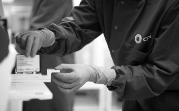 A photo of a lab scientist conducting a test