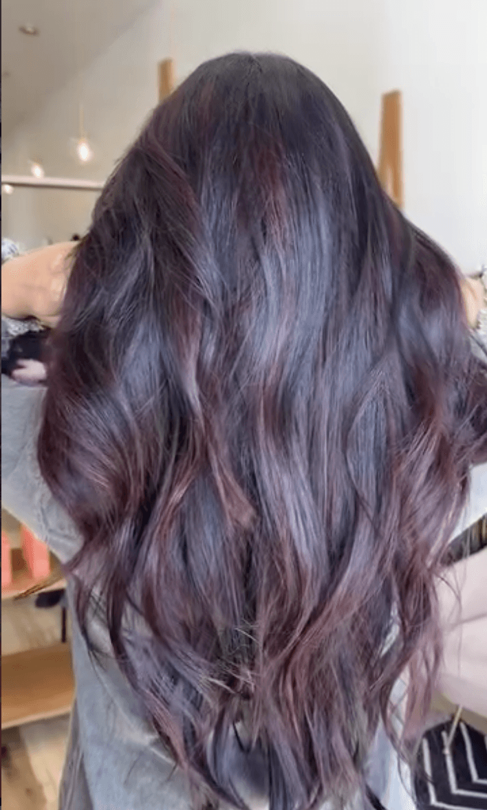 Rich cherry cola dimensional brunette color by Marlie Allen at Del Sol Hair Studio Huntington Beach