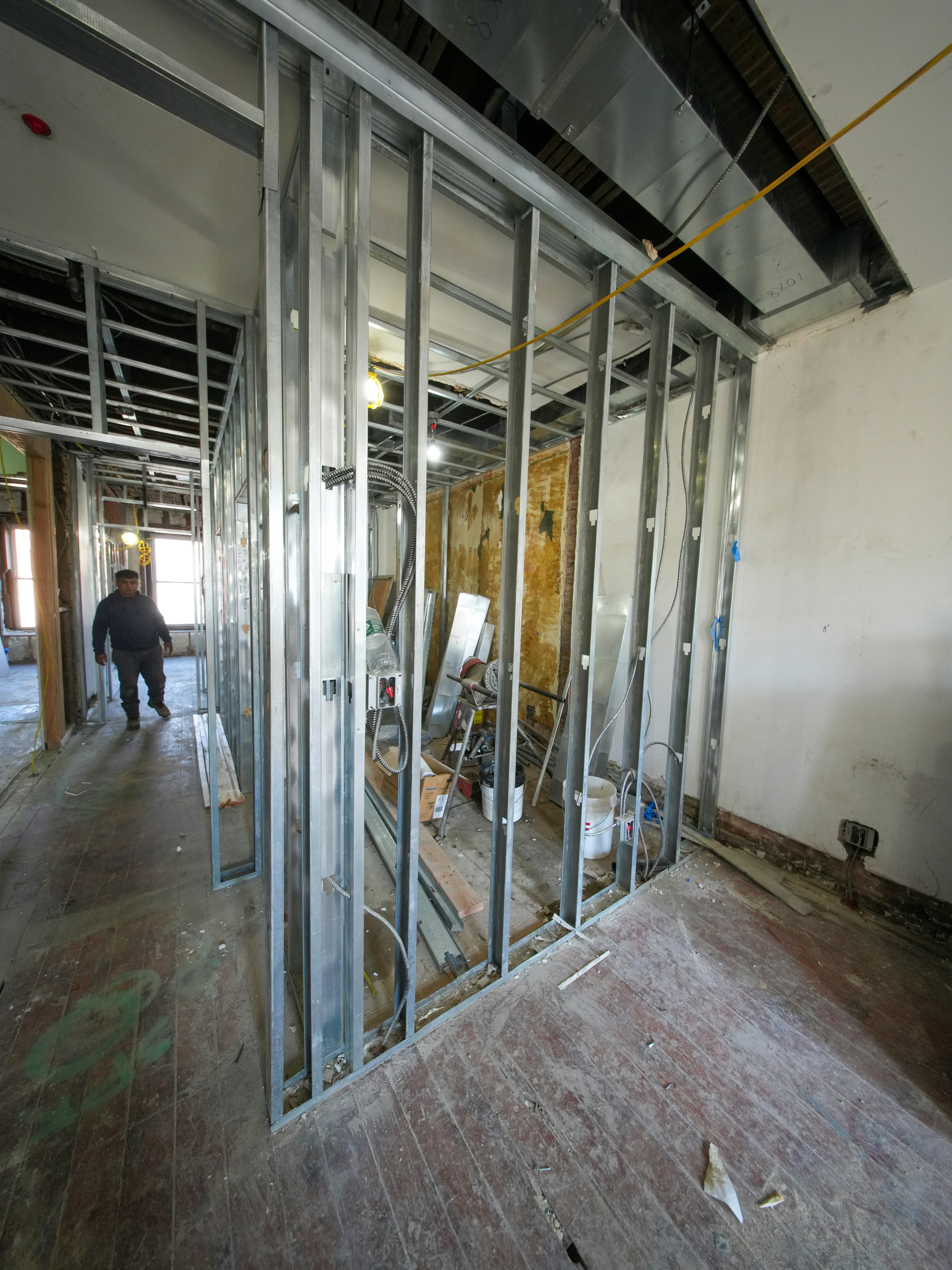 Interior construction with metal studs and unfinished walls.