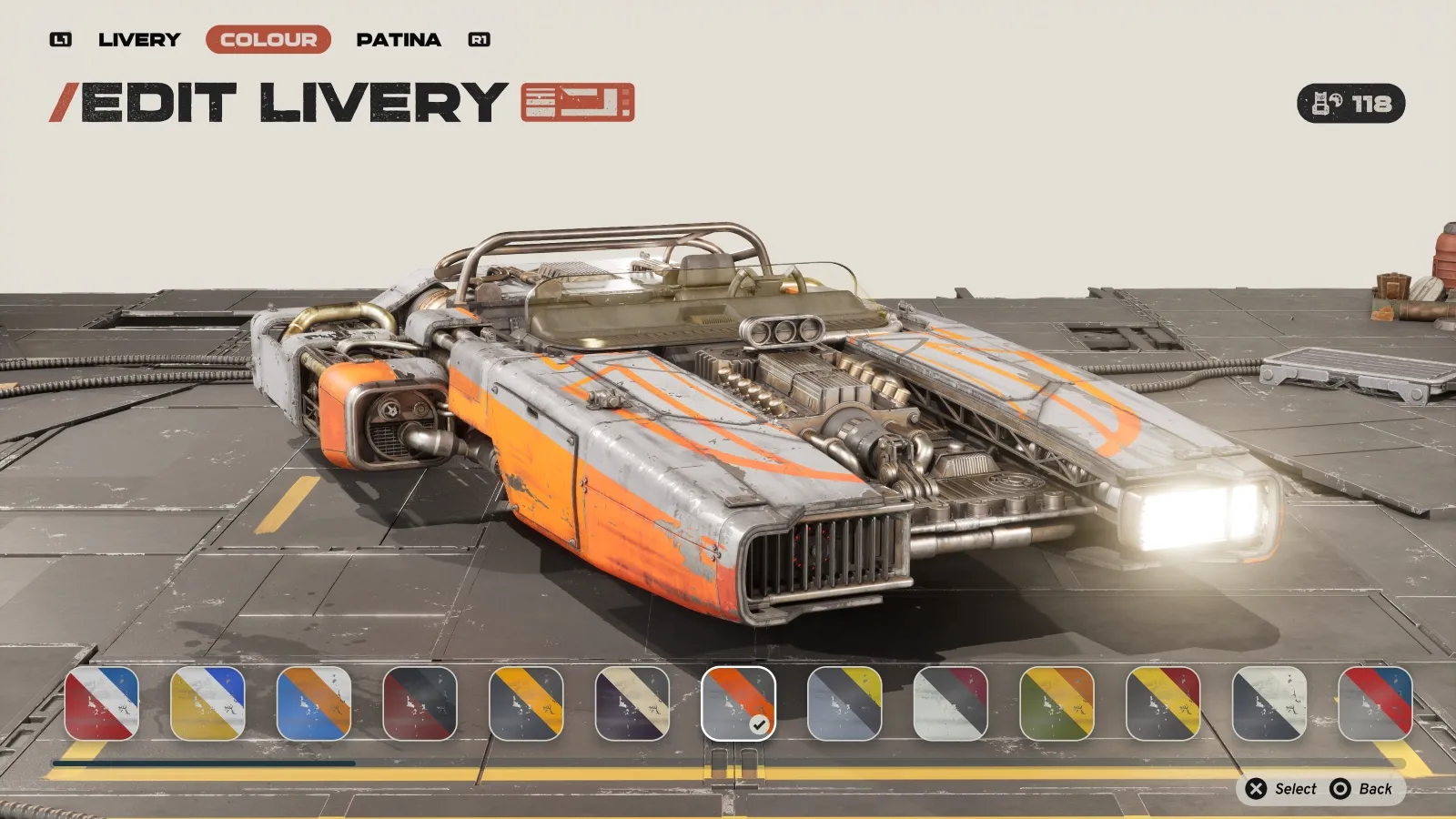 The image shows a futuristic hovercraft in a video game setting, with an orange and grey sleek design, displayed on a customization screen featuring options to edit livery and colour beneath the vehicle.
