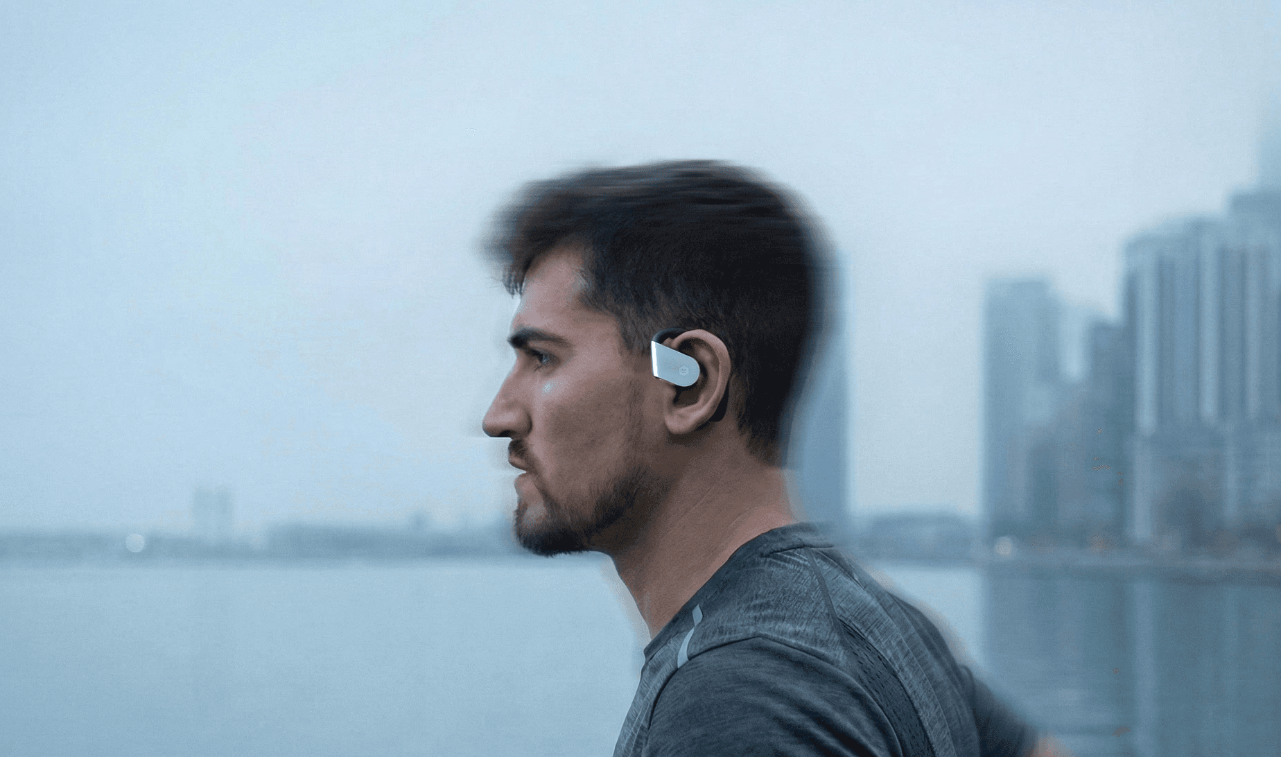 A person stands in a sandstone cave.