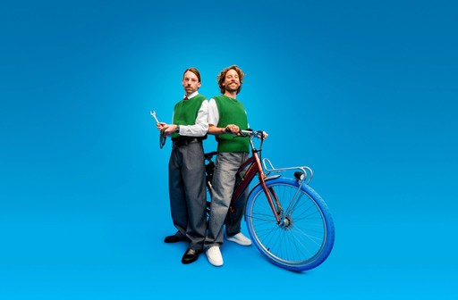 two men with a bike