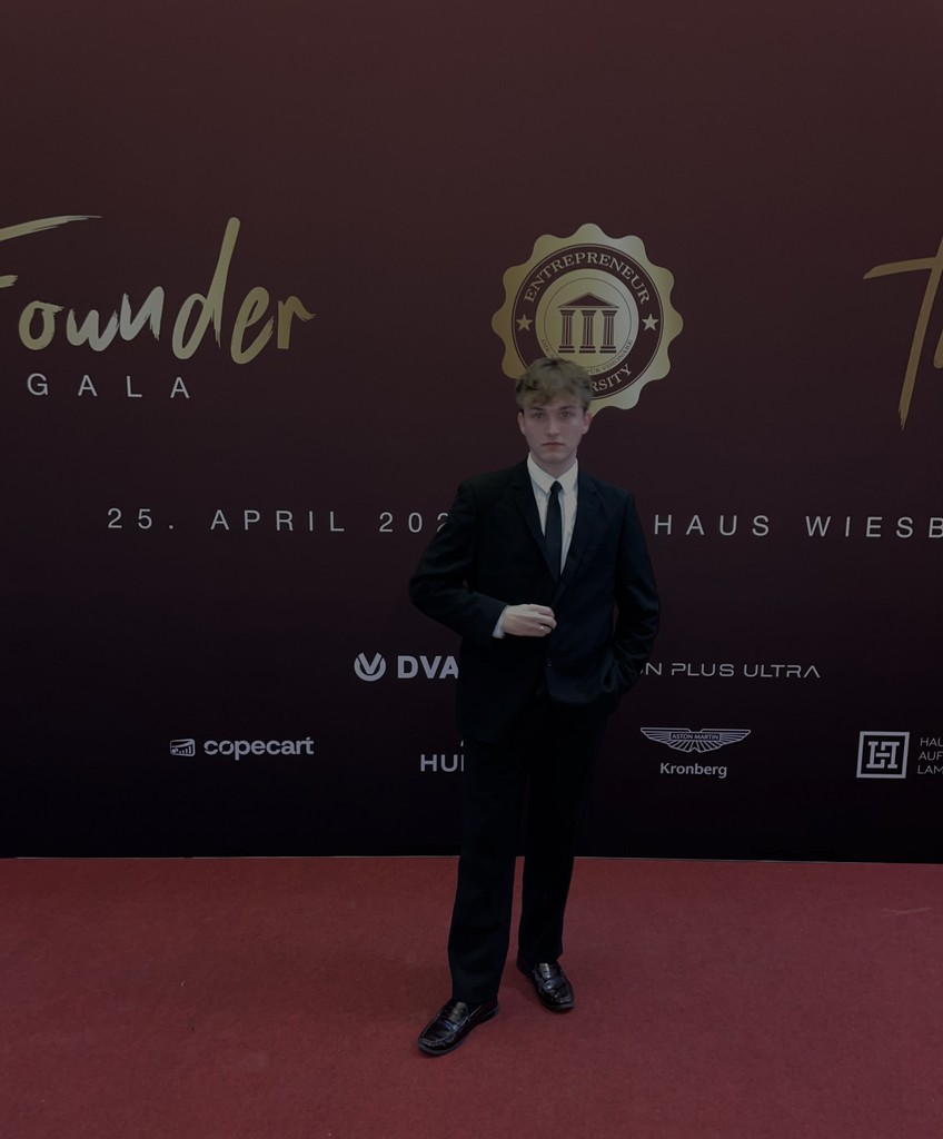 man wearing eyeglasses and blue shirt inside coffee shop