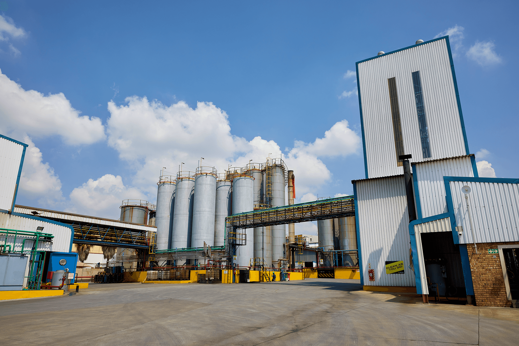 View of containers in motion at a large logistics hub located in a port.
