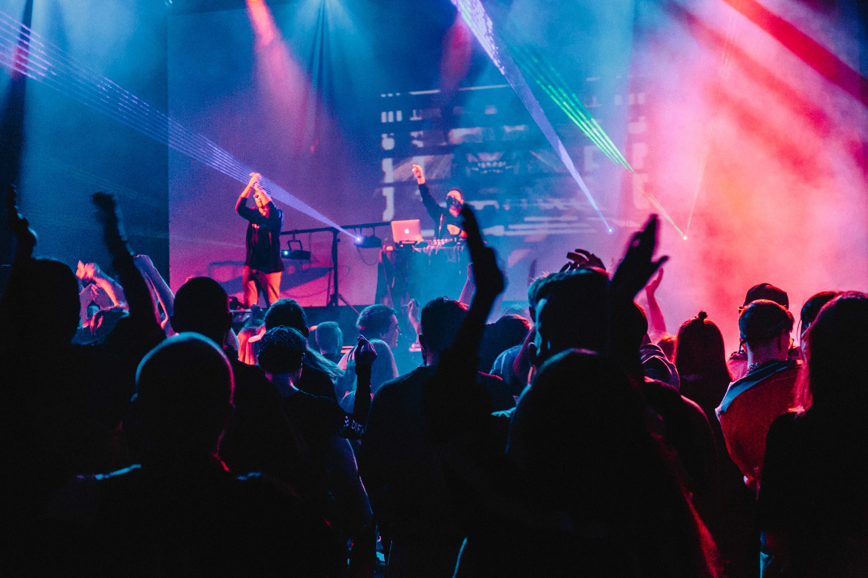 singers on stage entertaining crowd - how to write a song for beginners