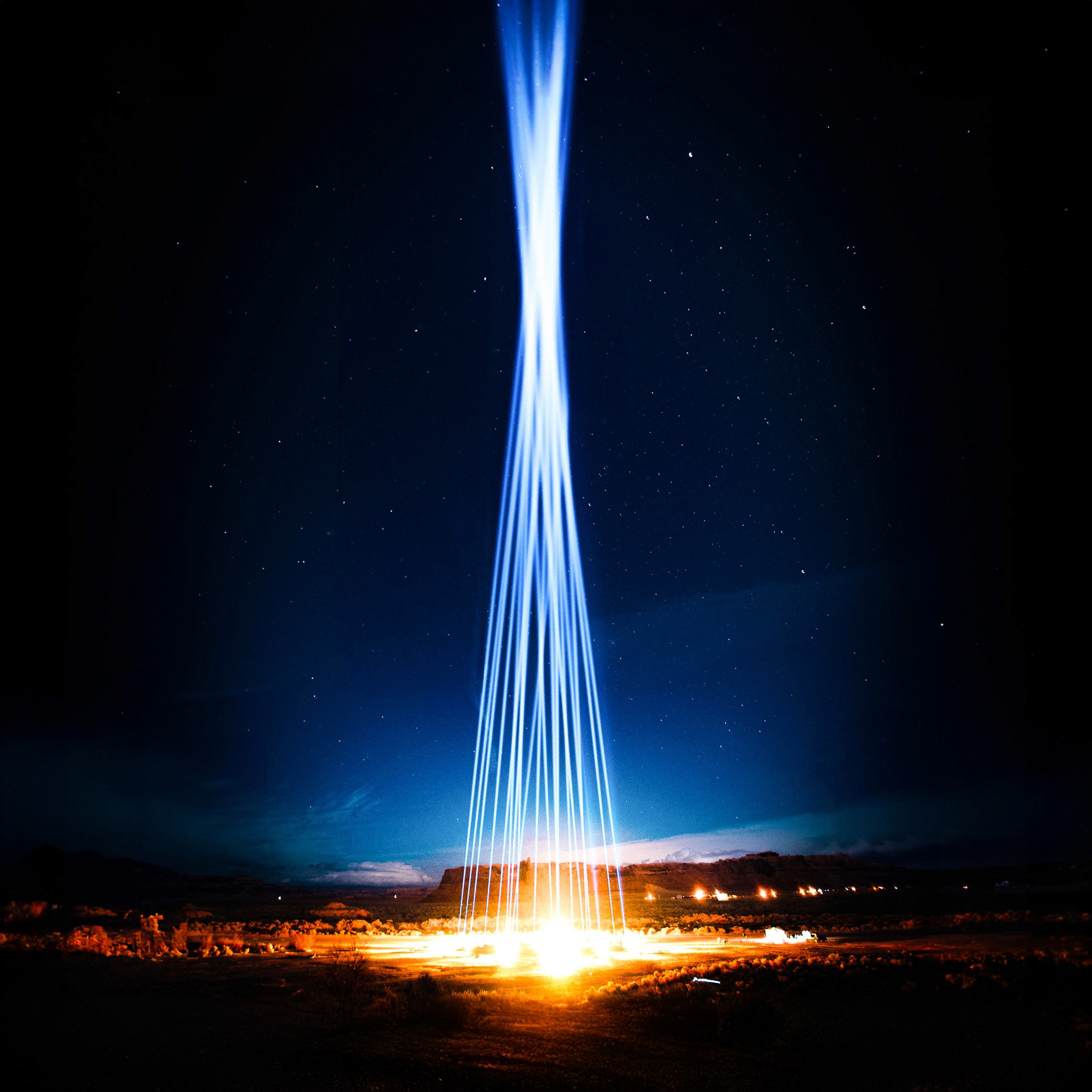 A massive display of light art where 1000 feet high columns of light shoot up in the night sky