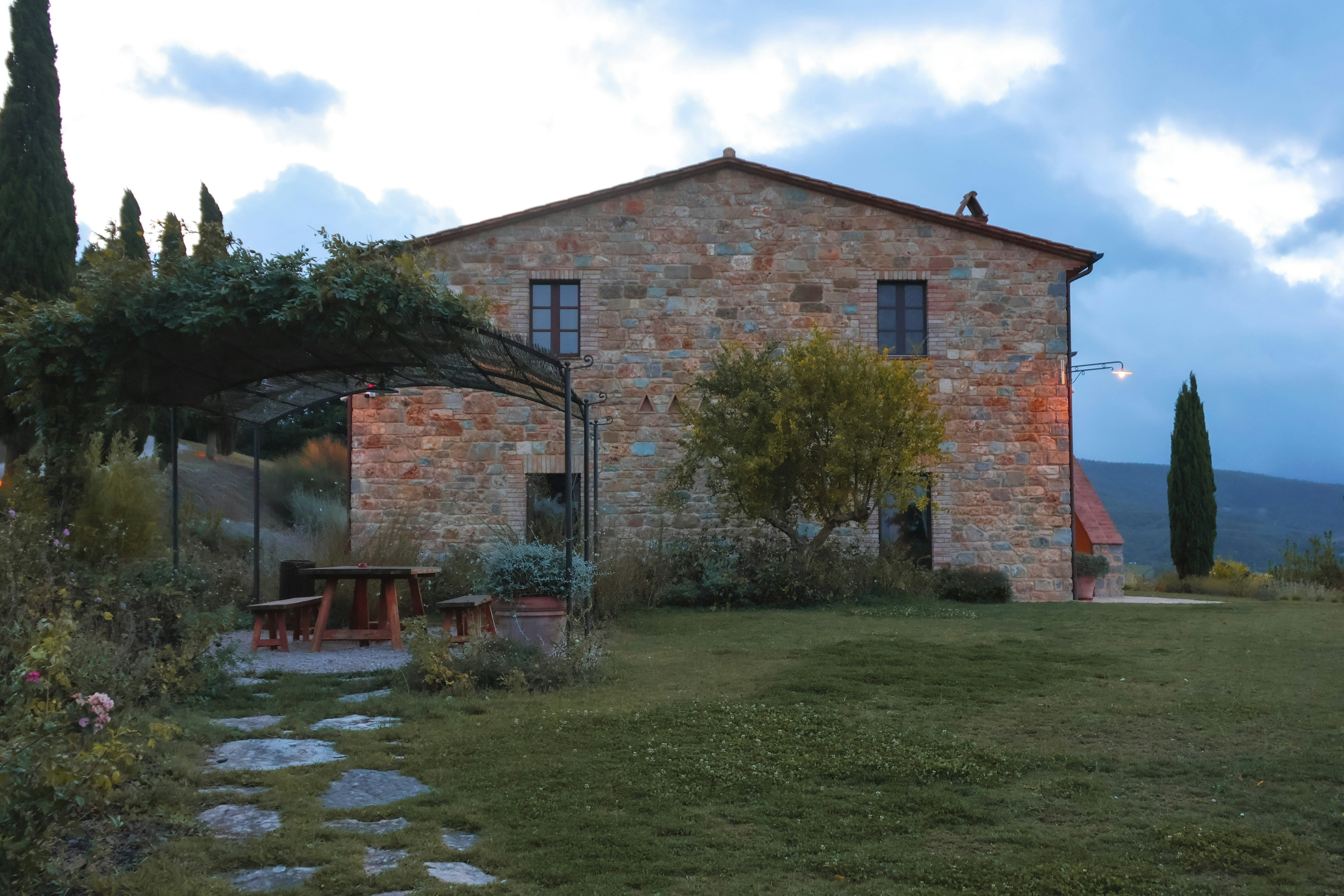 a stone house with a stone pathway leading to it