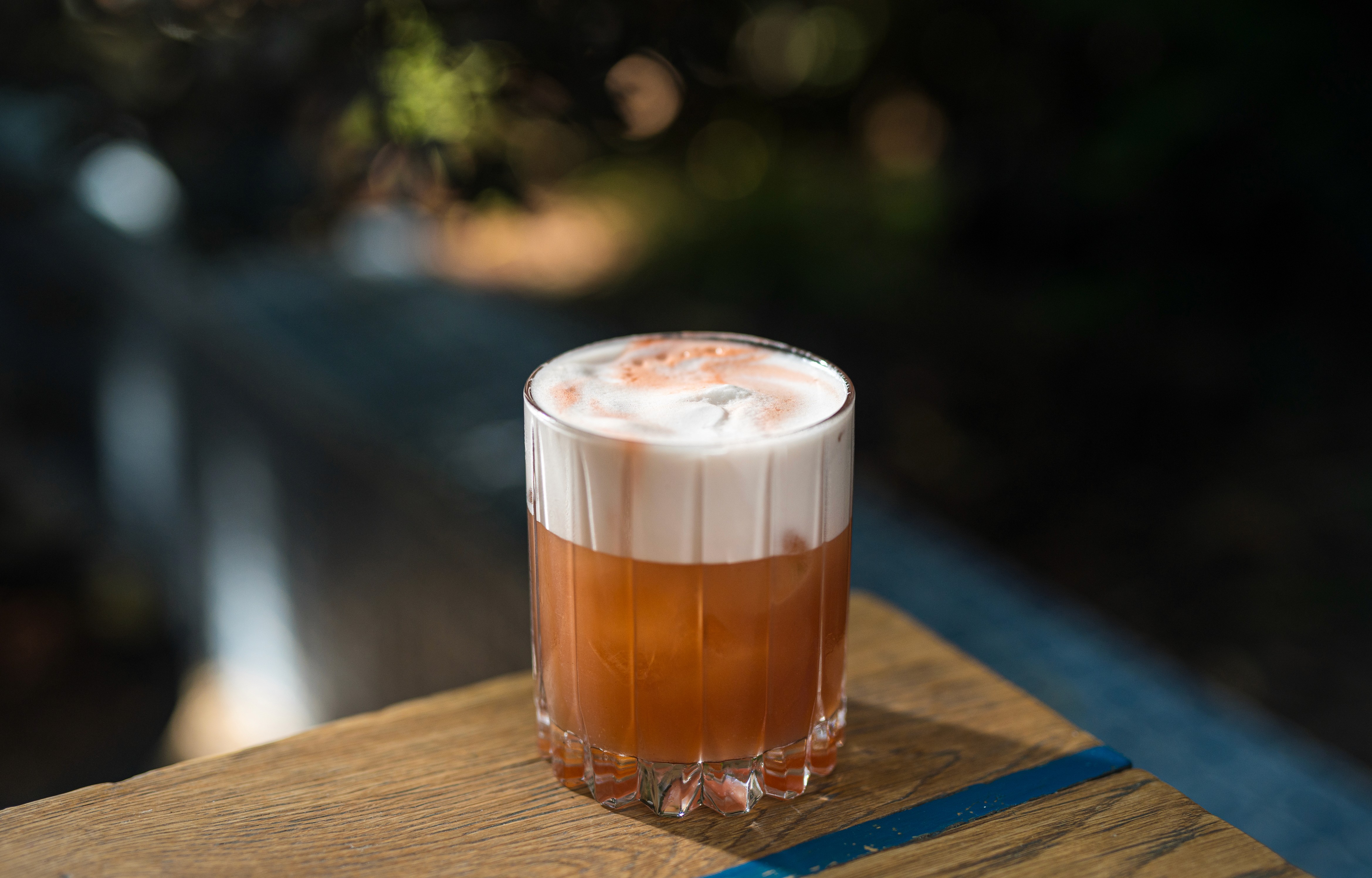 Colorful cocktail served in a glass with garnish