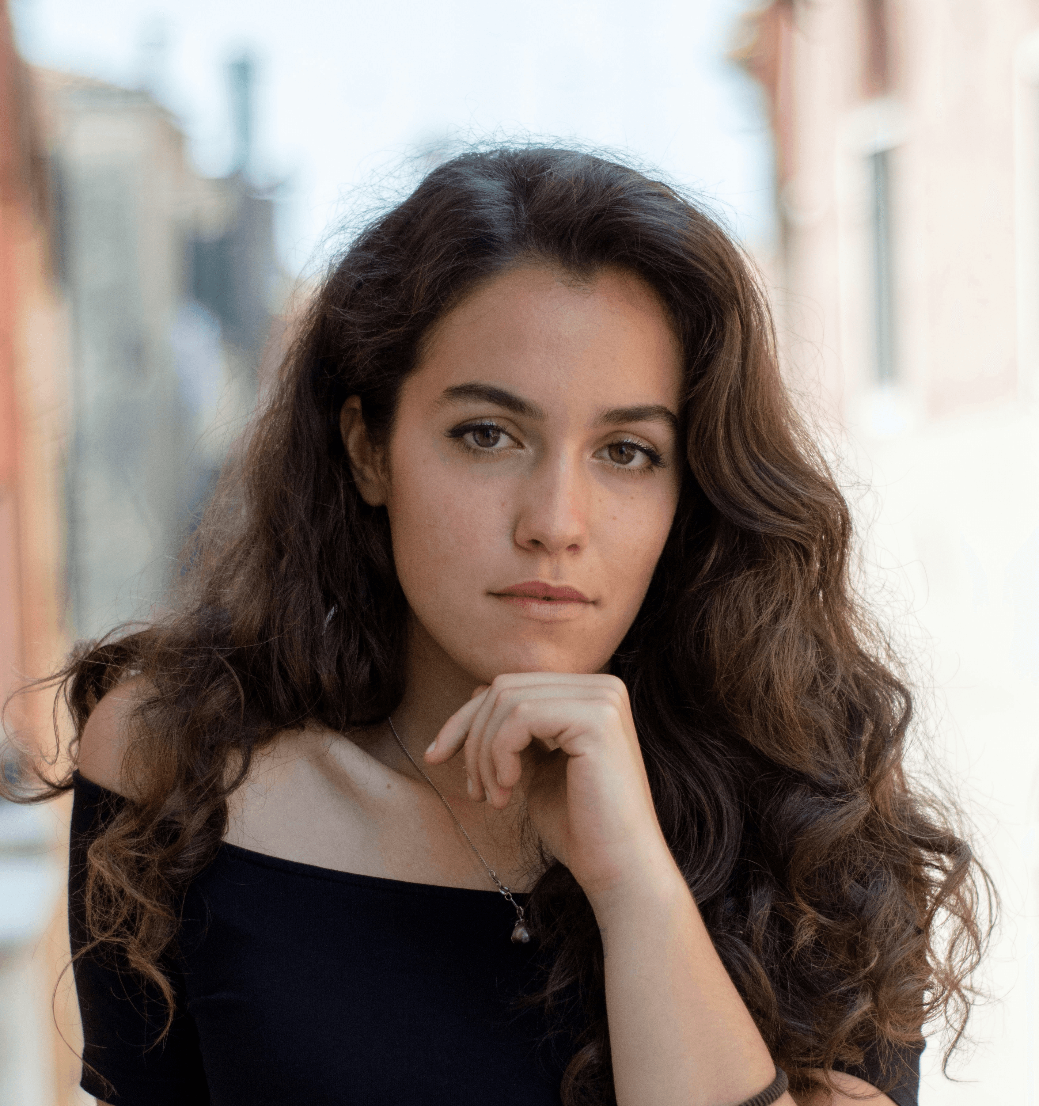 selective focus photography of woman wearing black off-shoulder blouse