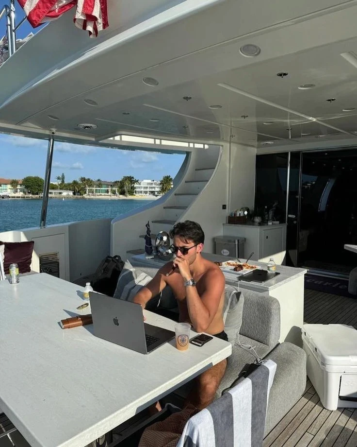 Luke Alexander working from a yacht in Miami