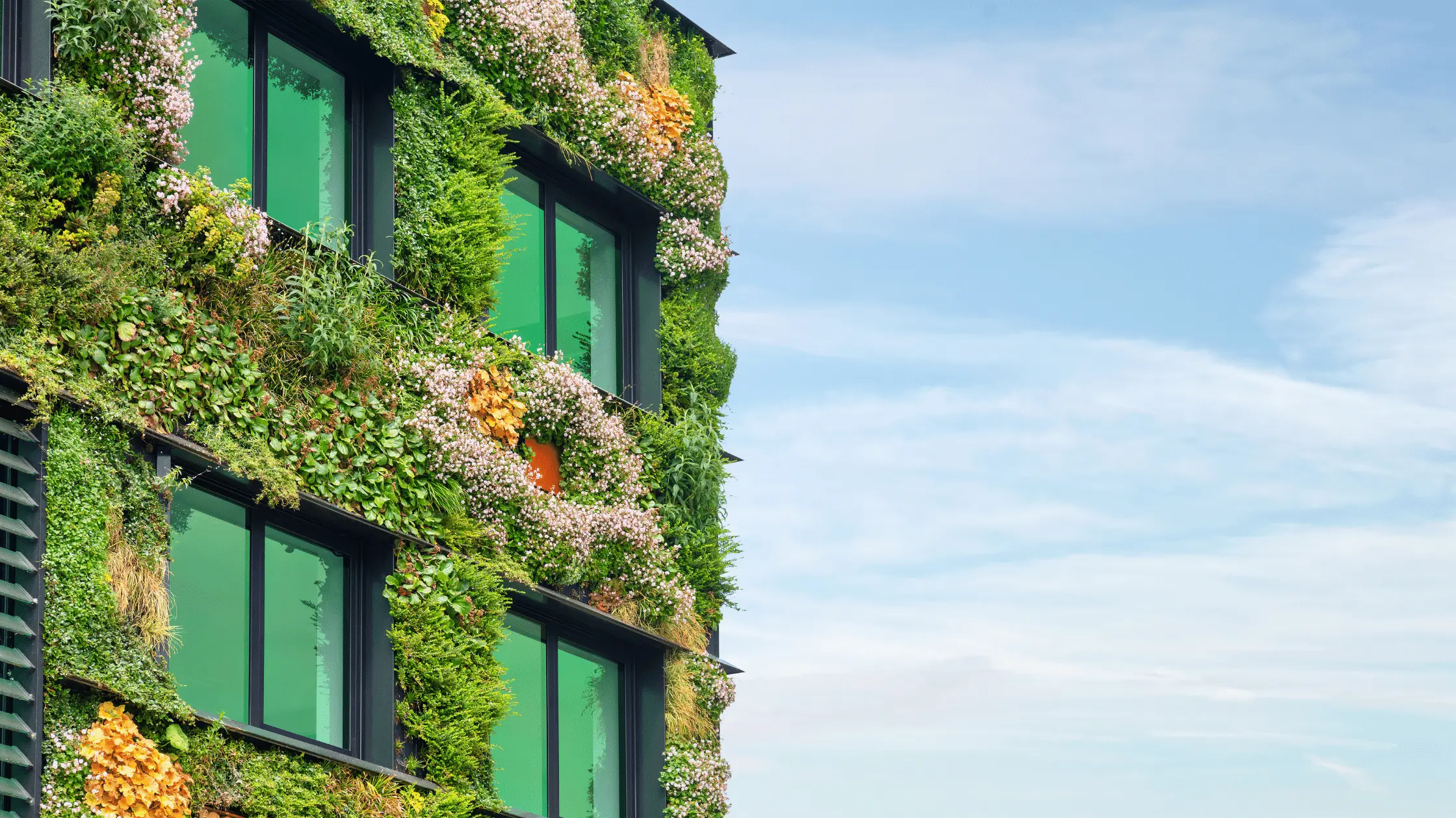 Office building covered in plants, image