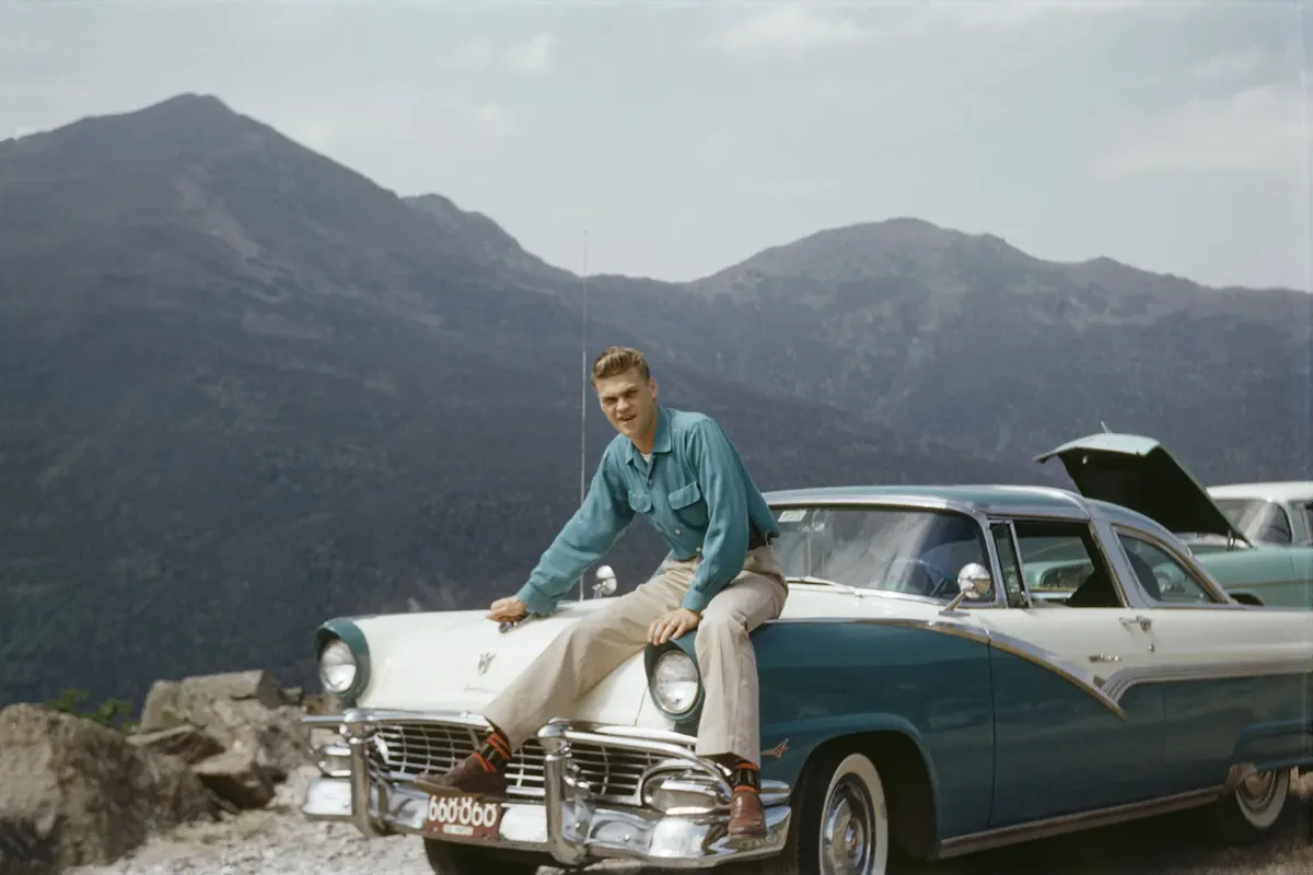Man sitting on a car