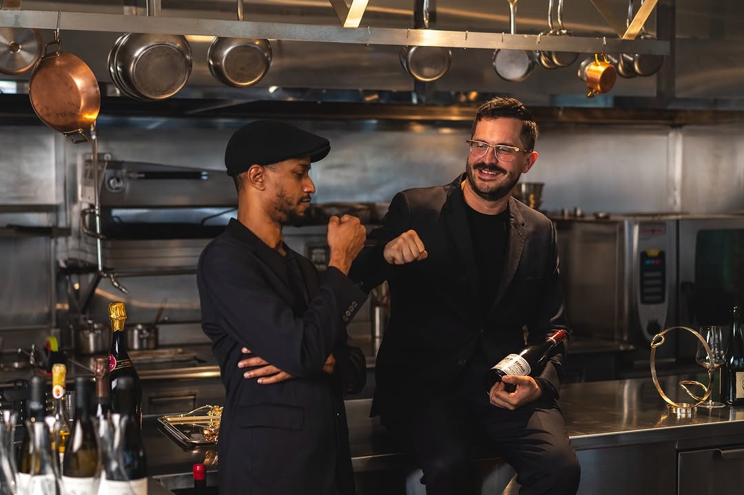 Chef Zhao Jing Dai and Maison Sun owner Carlos in the sleek open kitchen of Maison Sun, discussing the restaurant’s innovative modern Asian fine dining menu.