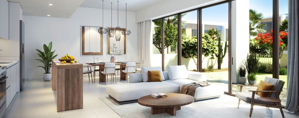 Modern interior of a living and dining area, highlighting outdoor views at Orania The Valley.