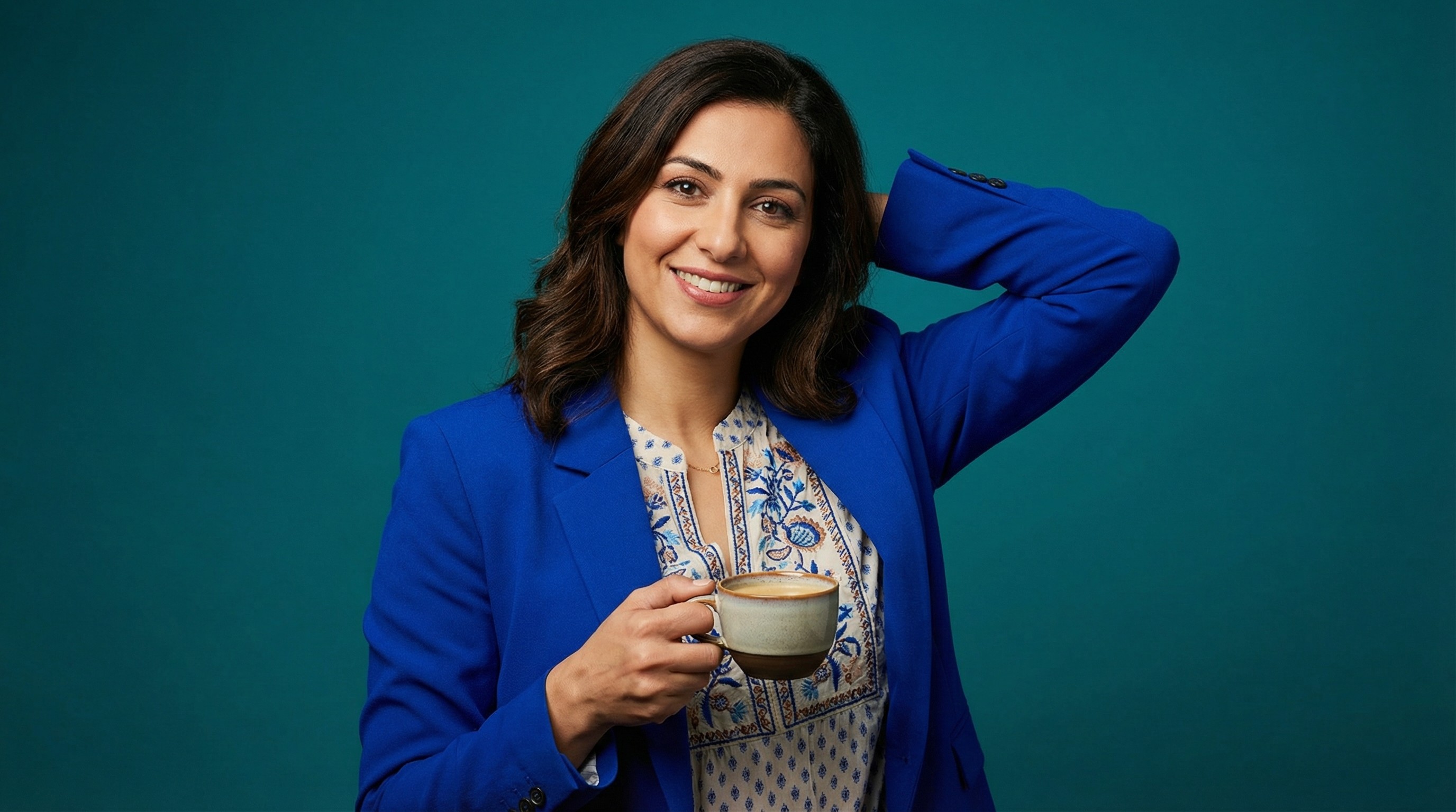 Close-up of lush, dark green leaves, some glossy and wet, against a muted background.