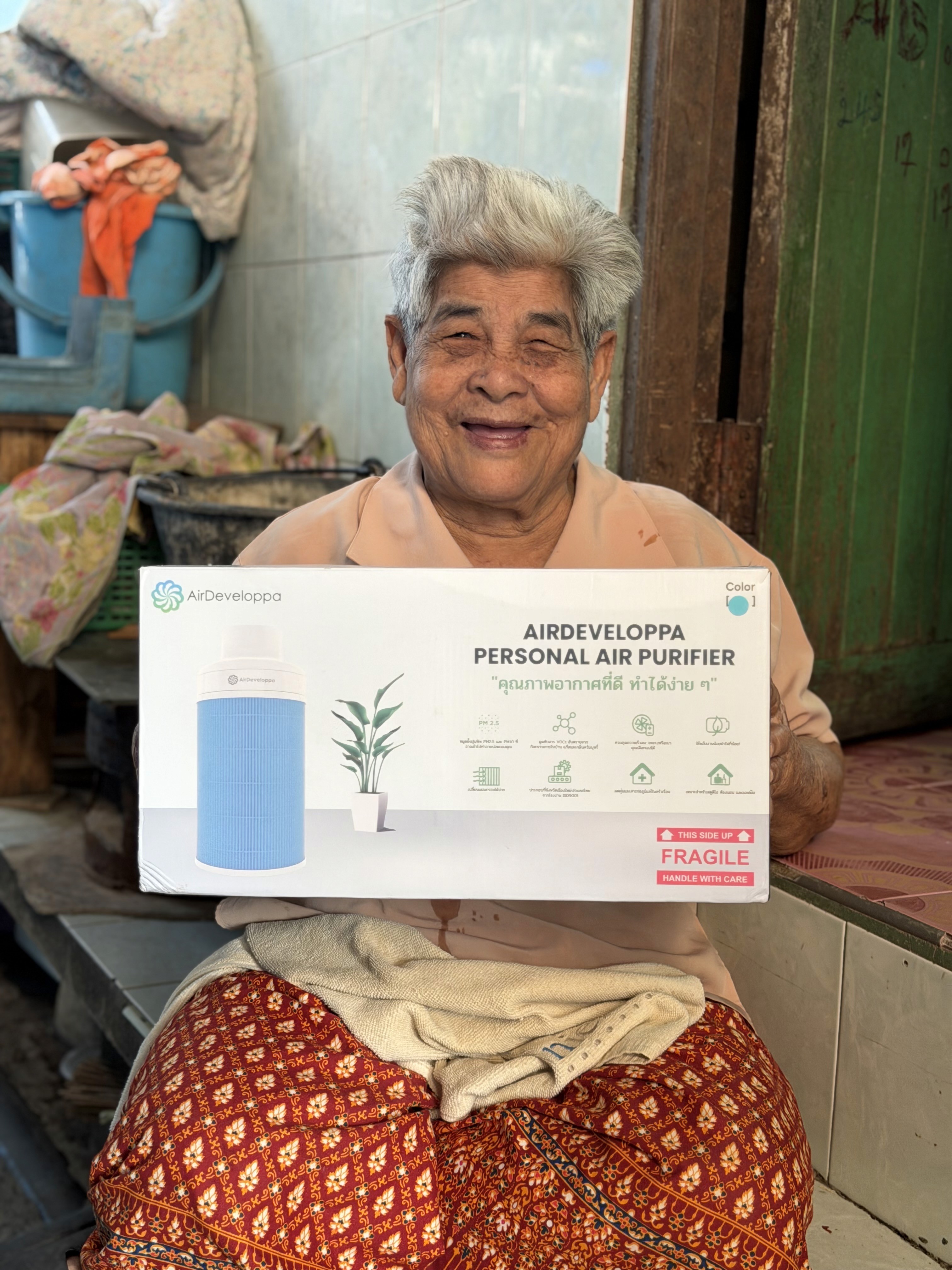 two young boys brushing their teeth in front of a crowd