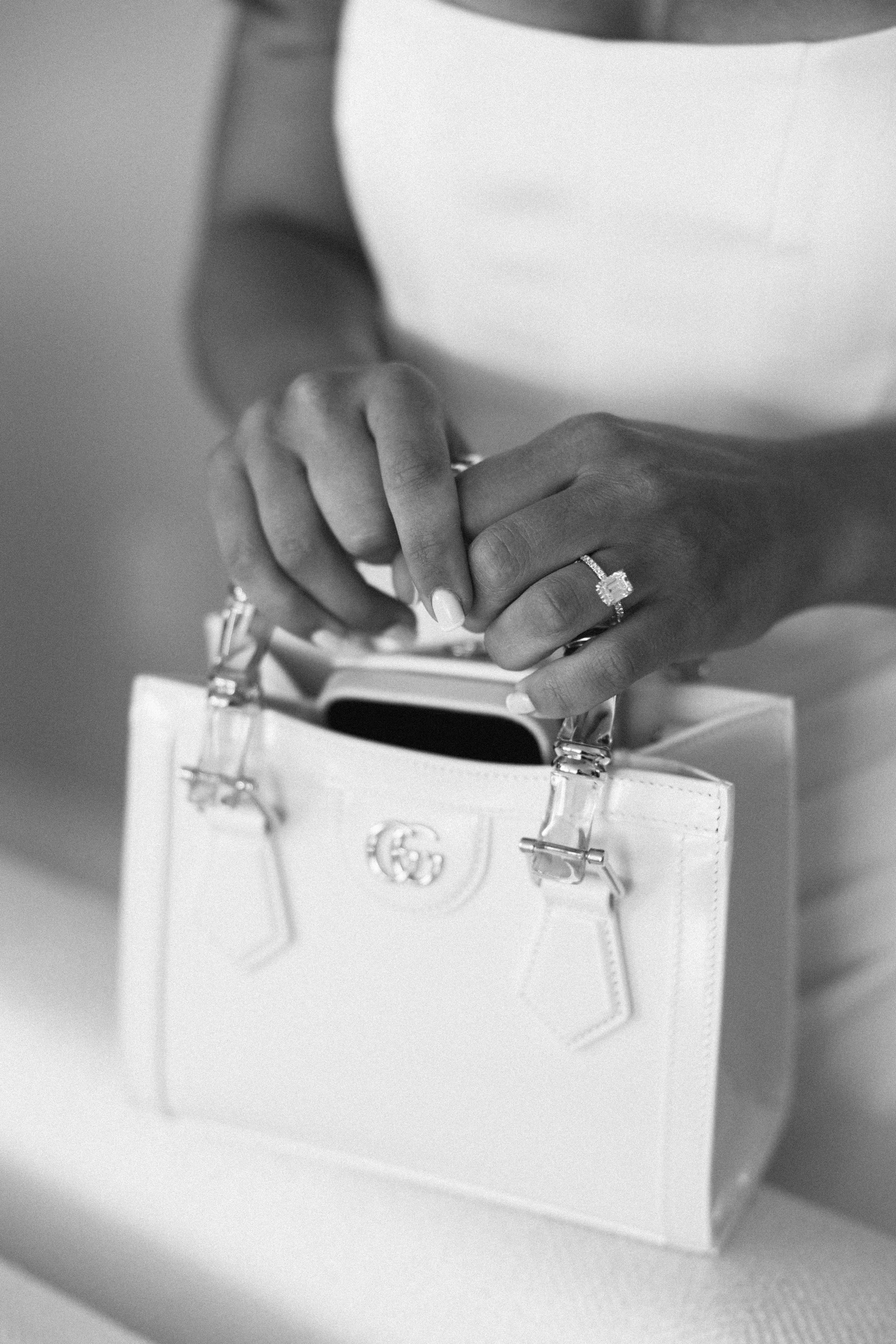 photograph of the bride holding a bag