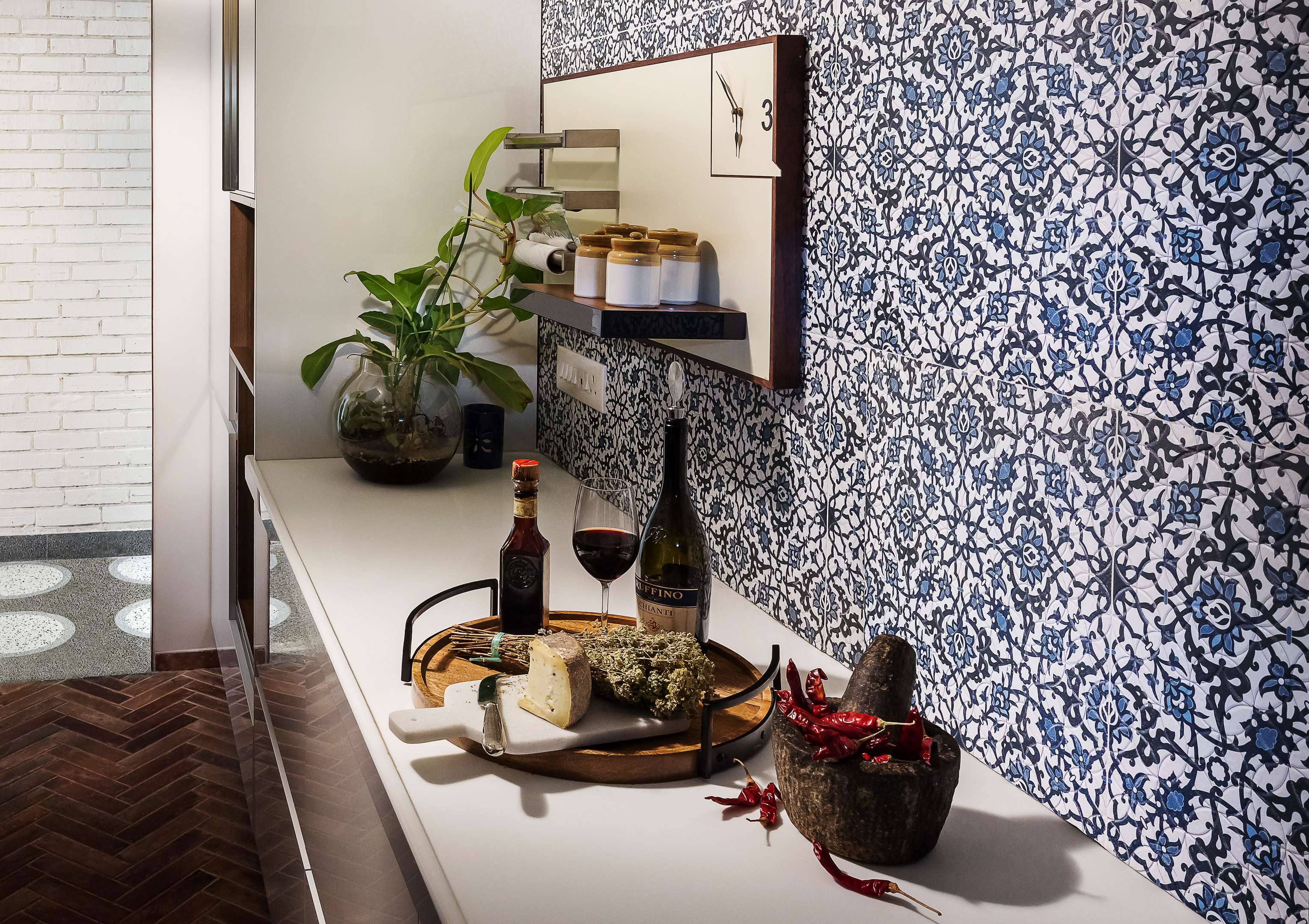 Nature-inspired preschool entrance with sculptural tree partitions and suspended green leaf ceiling panels.