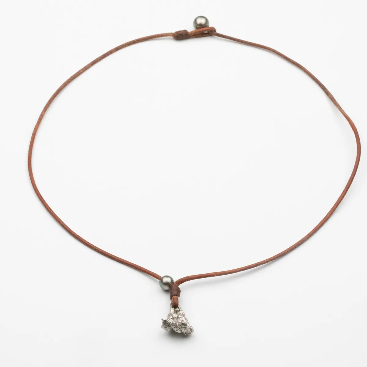 Silver organic pendant and Tahitian Pearl on natural leather cord necklace with pearl closure — Manos de Oro Saint Barth