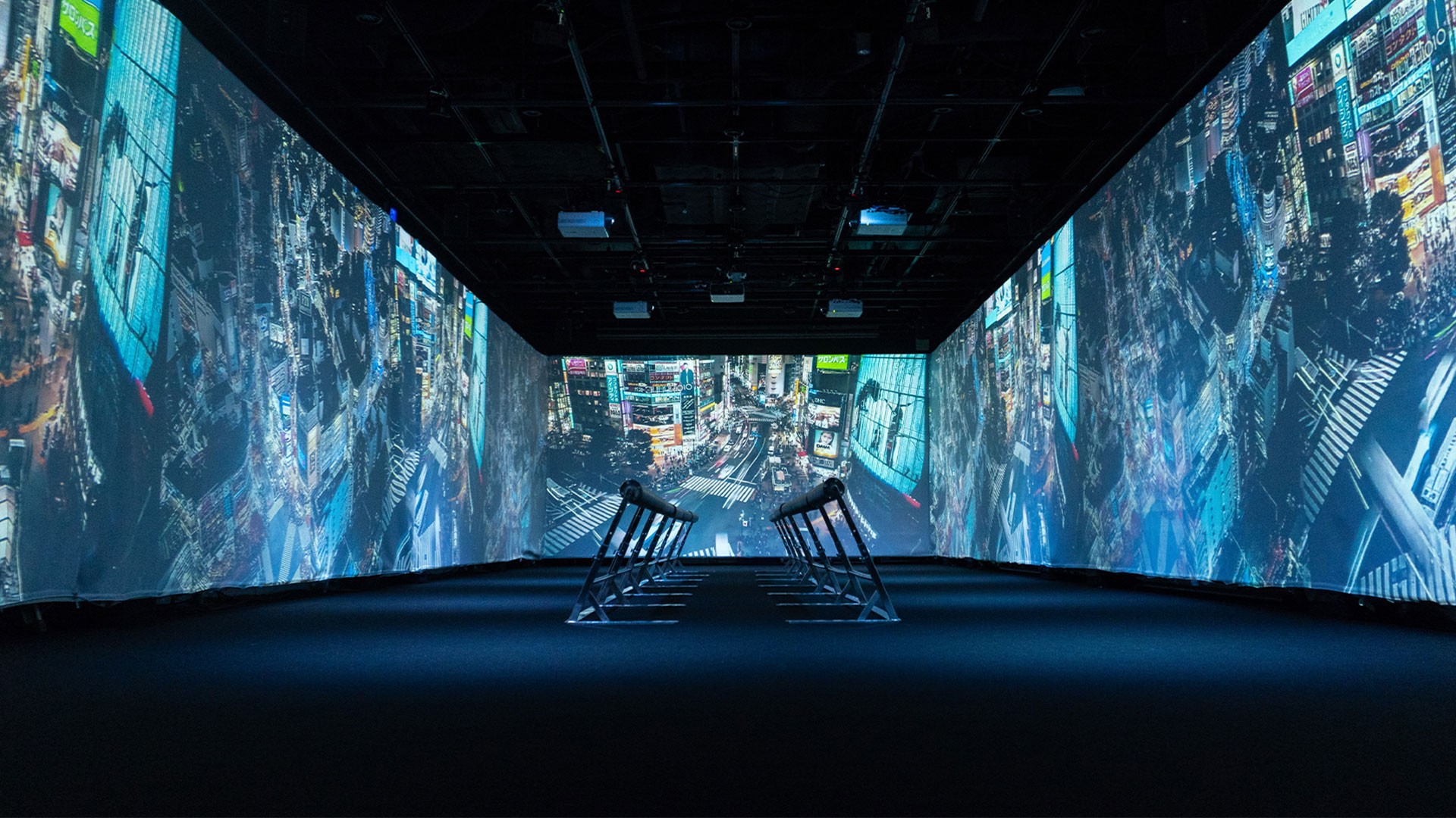 A crowded black-and-white art exhibition with abstract paintings on the walls