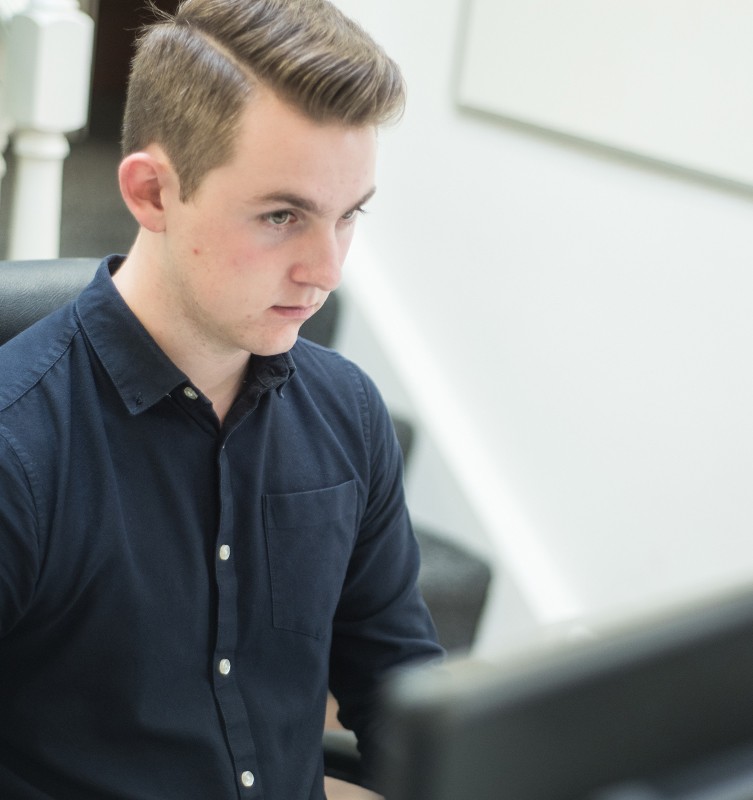 Photo of Andrew in the office