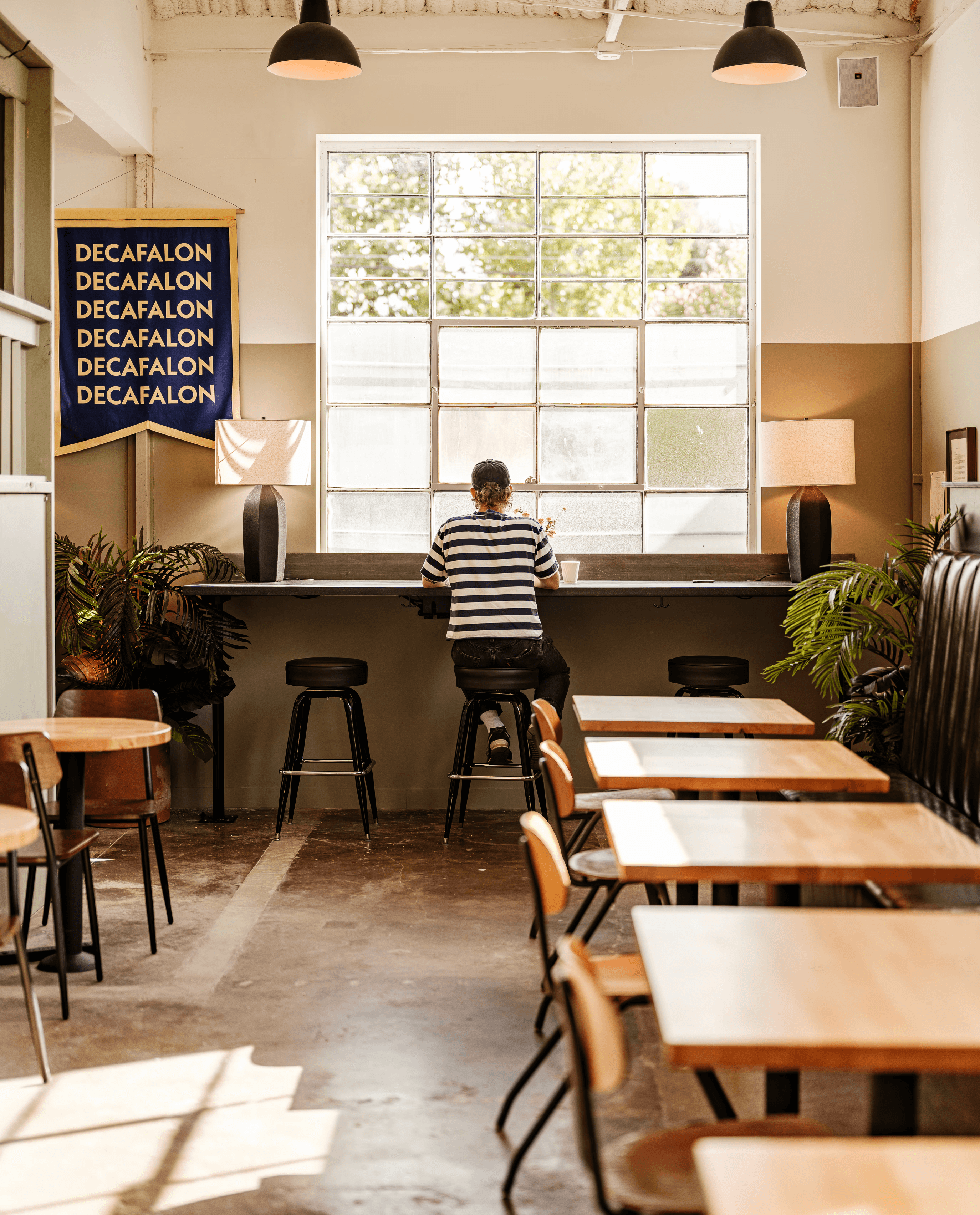 Interior of the East End Switchyards club with workspaces and seating