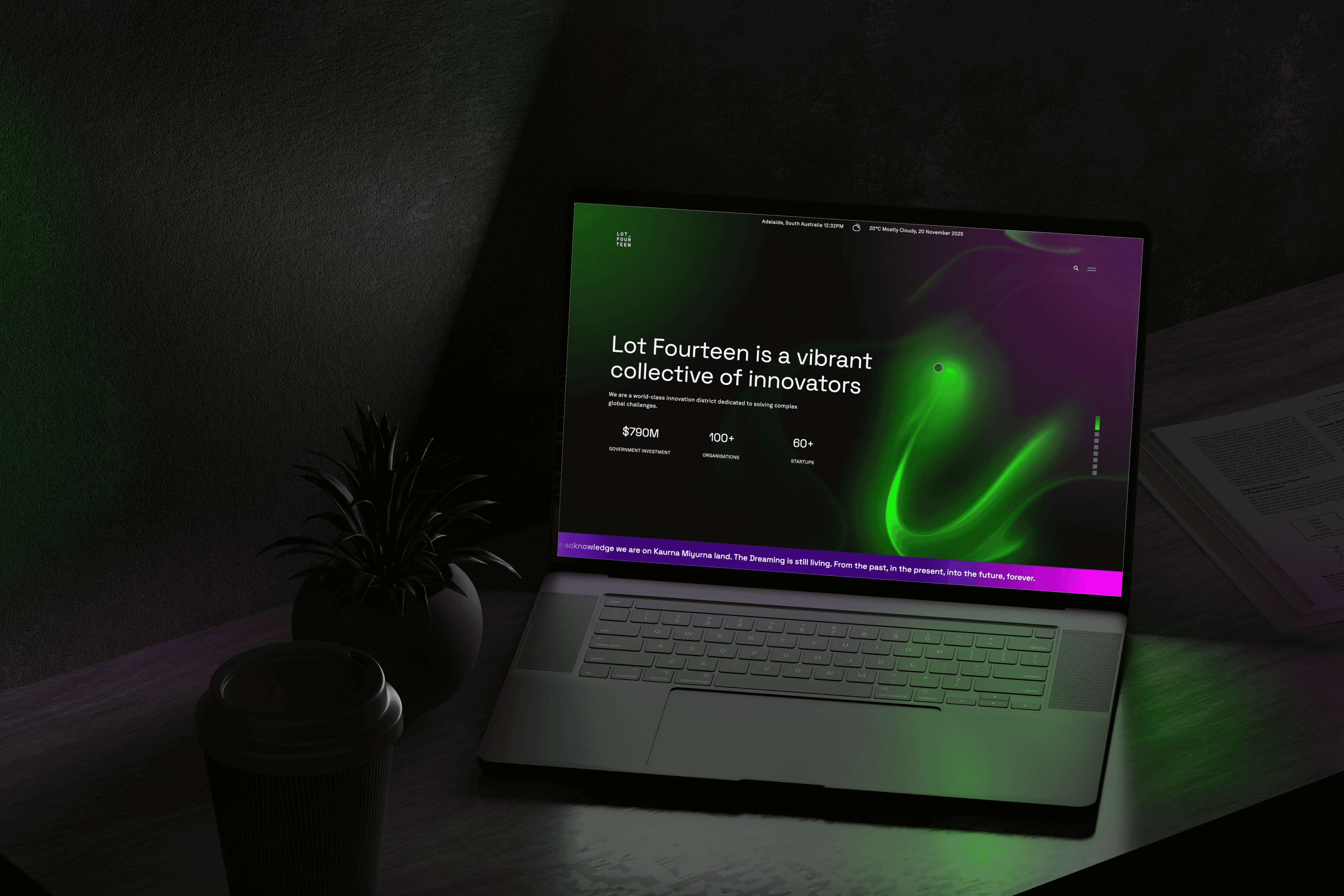 A dark room with a laptop screen open