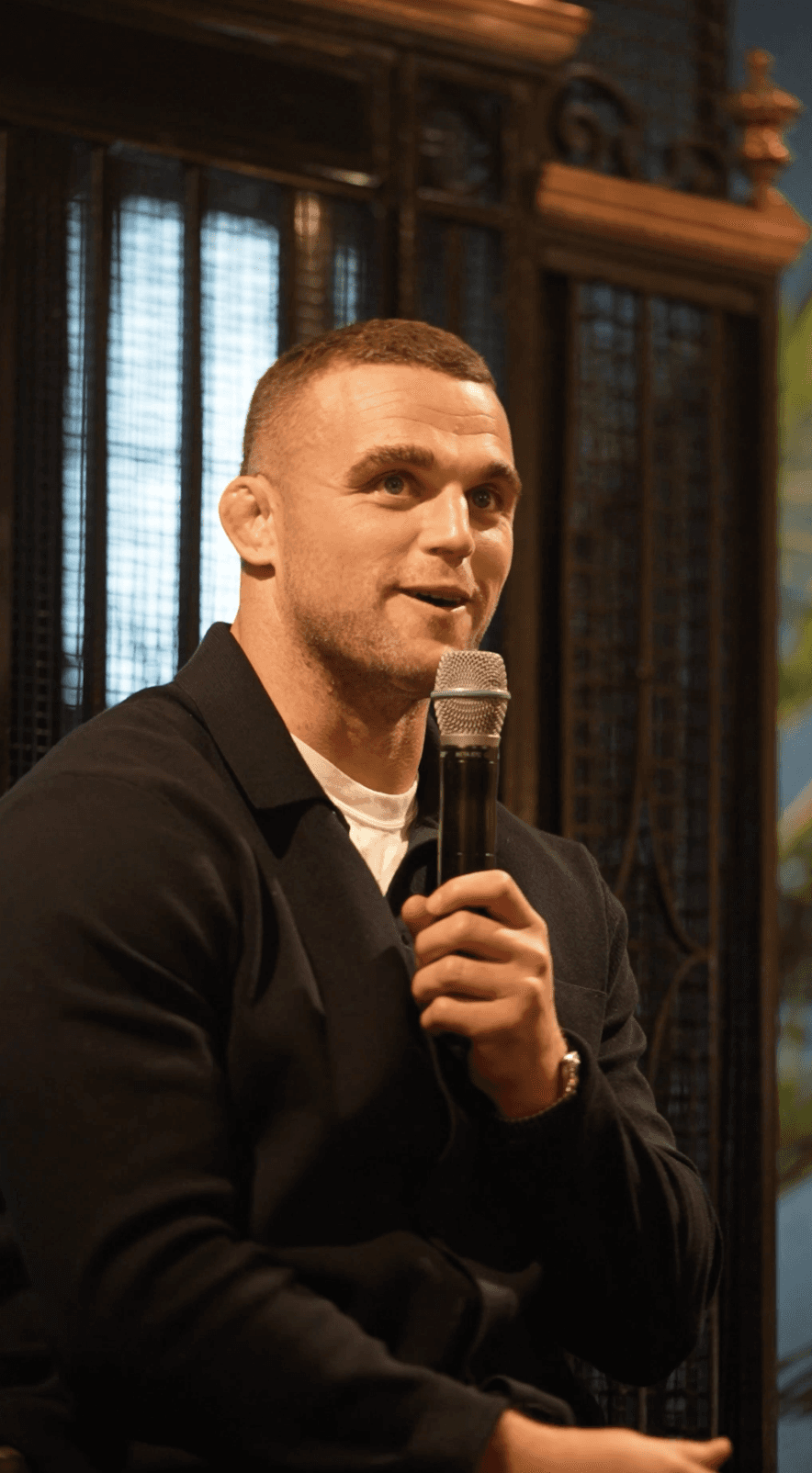 Couple embracing on street, bride's face obscured