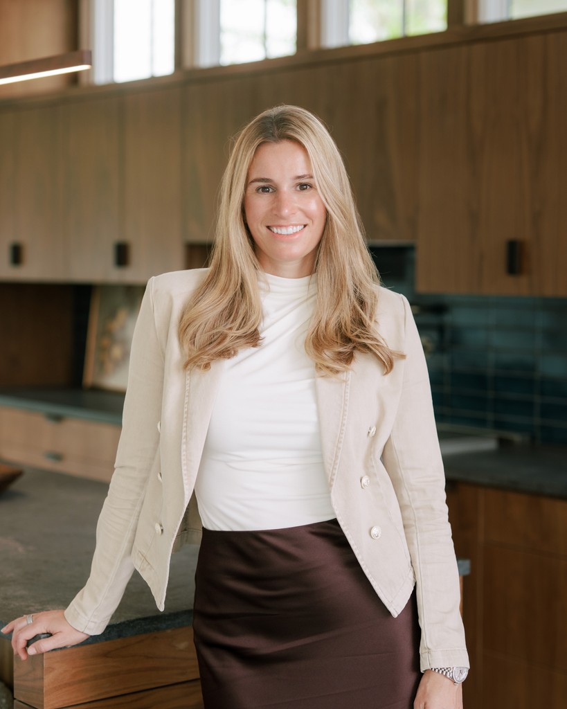 person sitting in a chair in front of a man