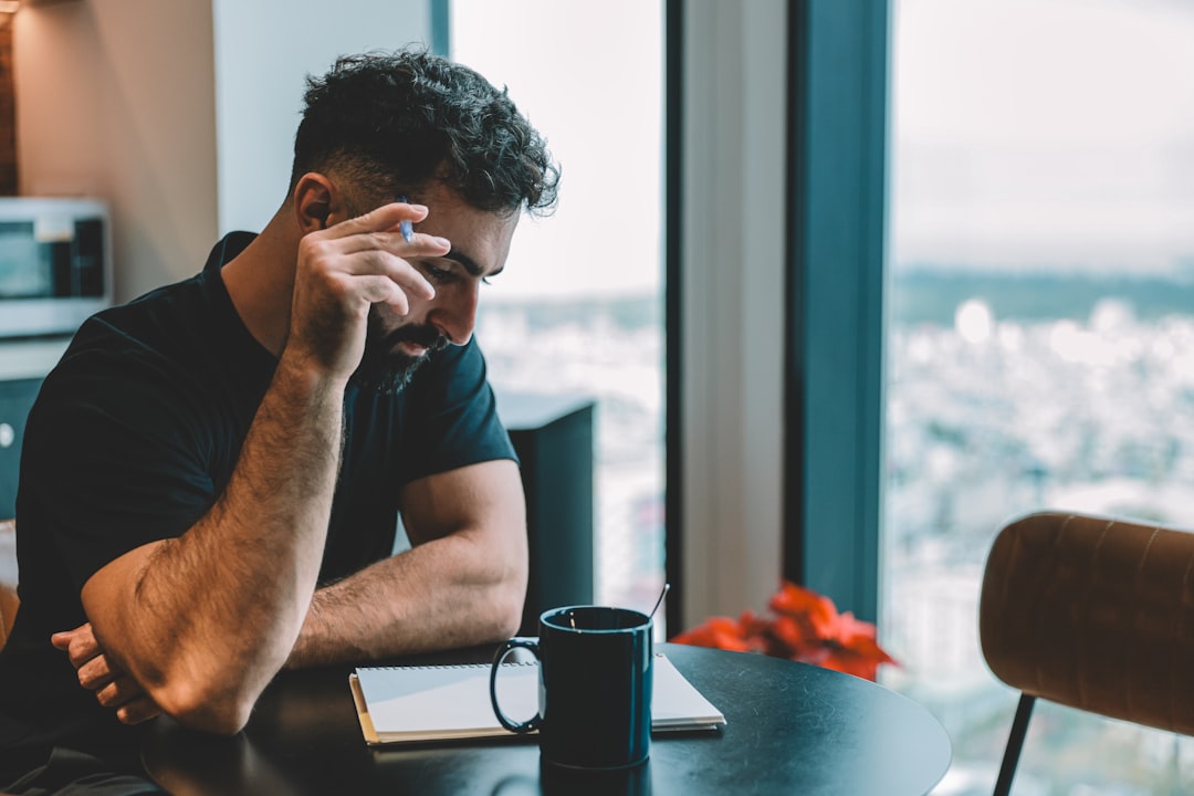 A person looking stressed while reading a legal letter - debt summons response letter sample