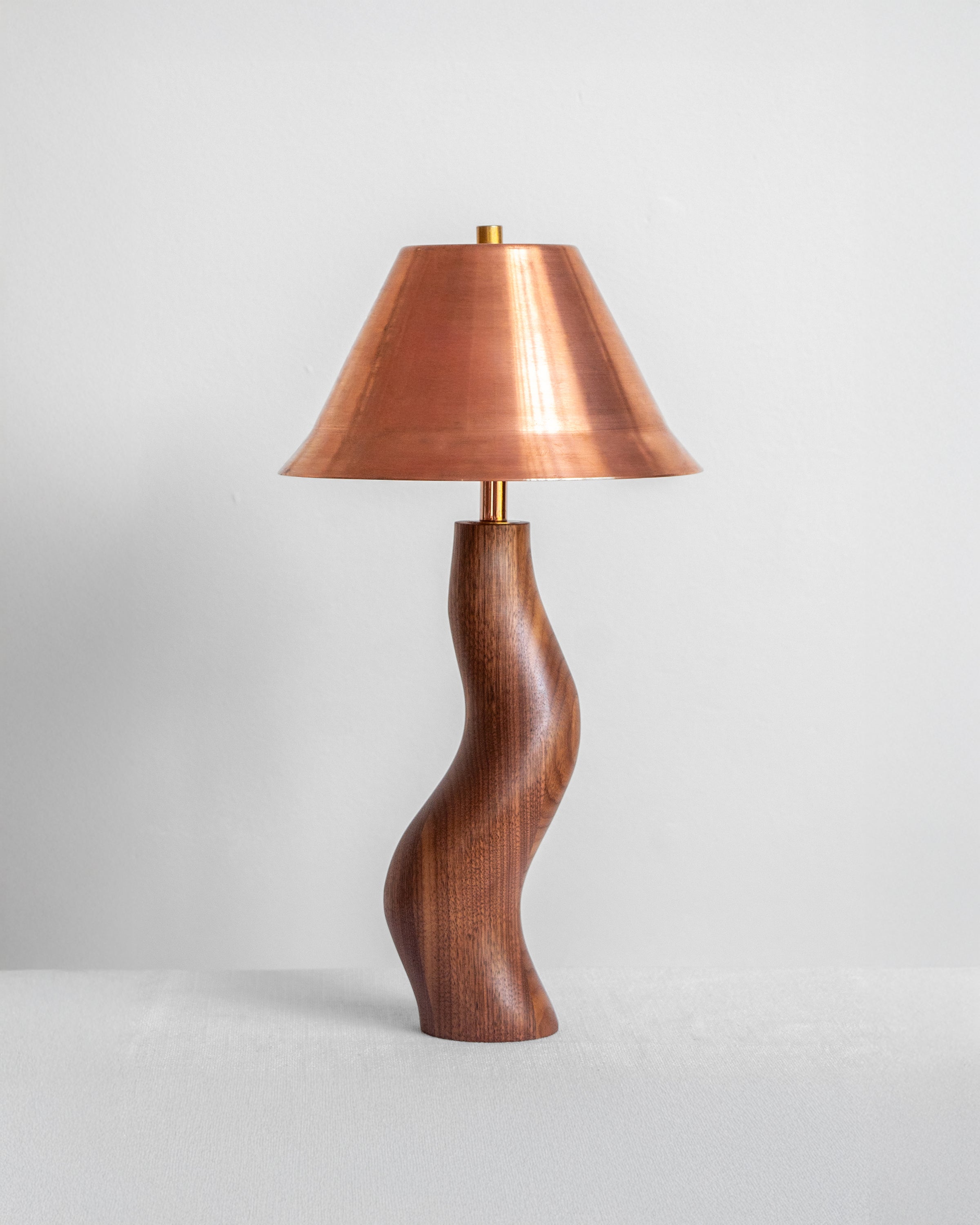 Dancing Desk Lamp with Walnut base and Copper shade on a light grey background with UK, EU and US/CA wiring available Wilkinson & Rivera
