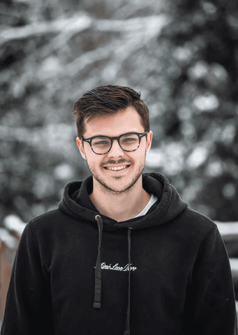 man in black hoodie wearing black framed eyeglasses