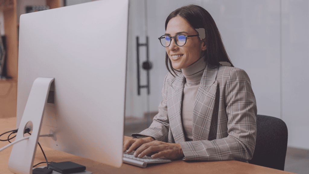 Woman founder on laptop in office