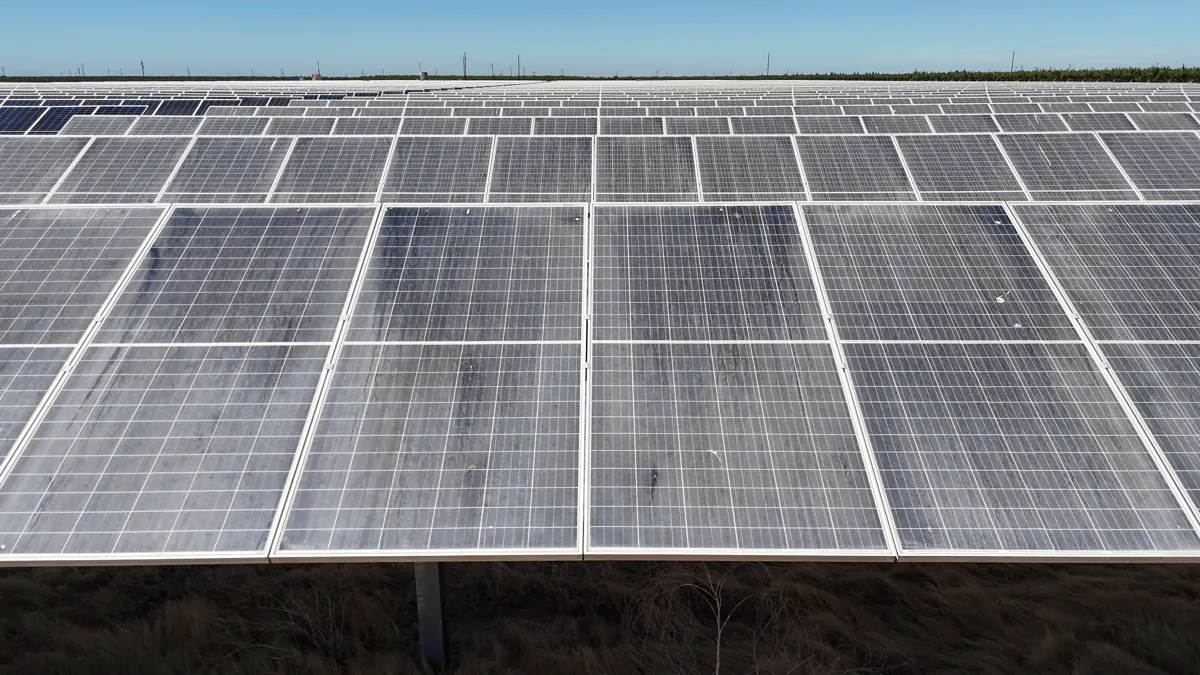 Close drone view of ground-mount solar panels at Wine Group in Madera County, CA