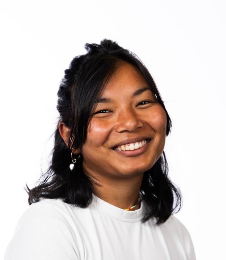 two people looking at a tablet and smiling