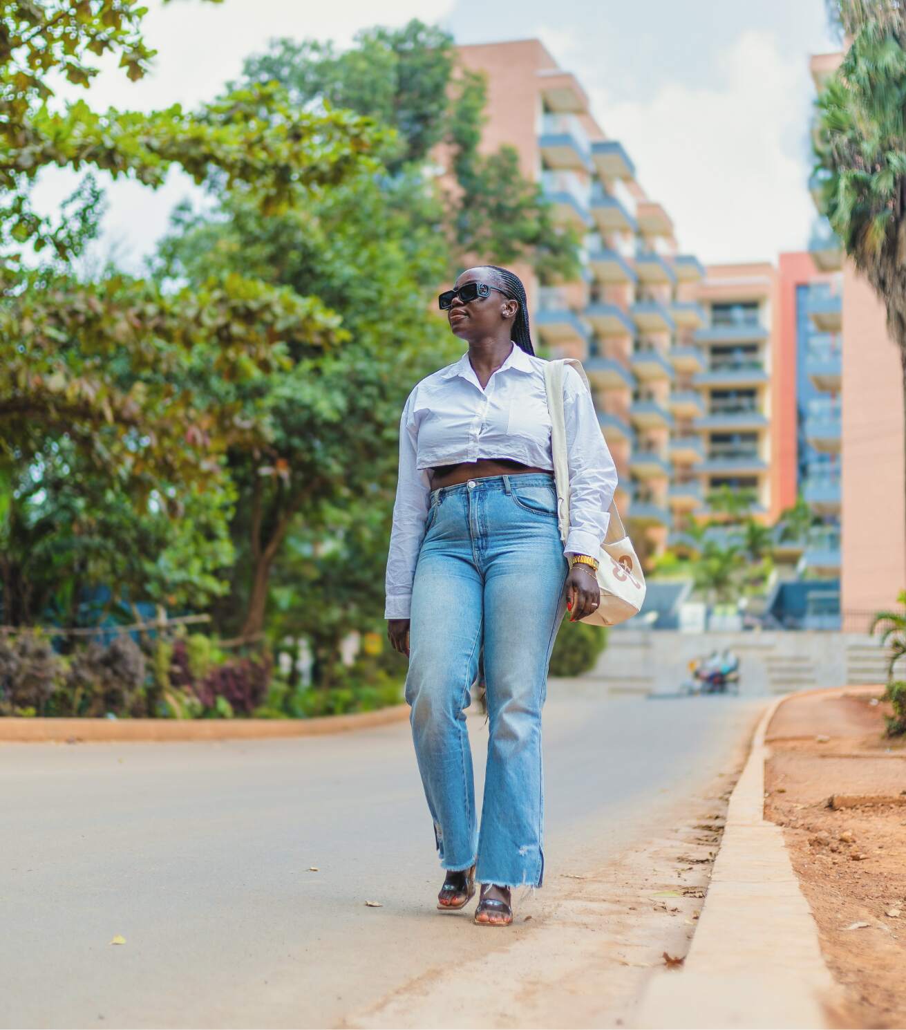 Mary Consolata Namagambe walking elegantly through the streets of Kampala, Uganda