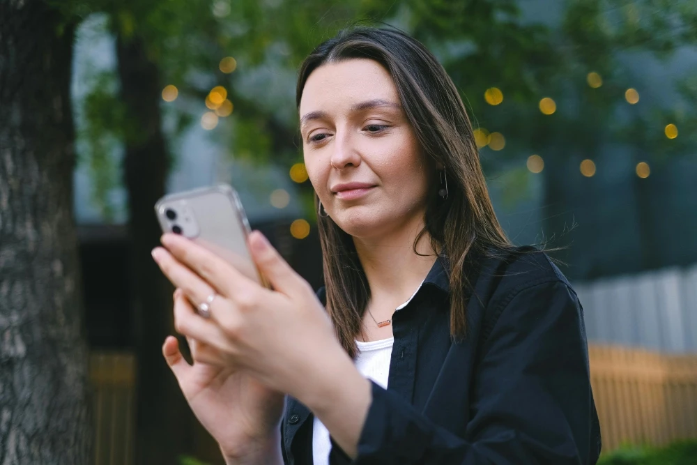 woman looking at phone