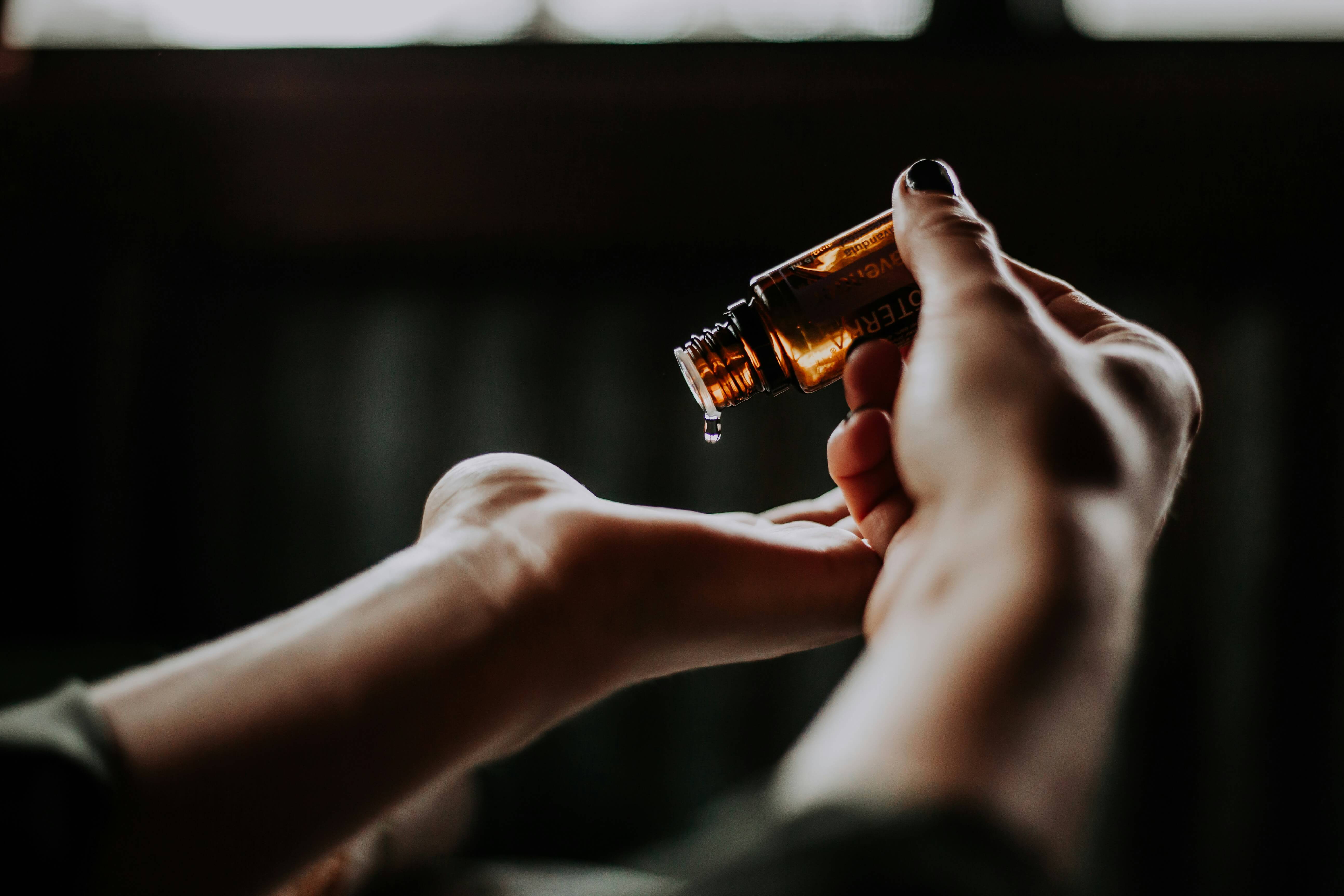 a woman holding a skincare product in her hand