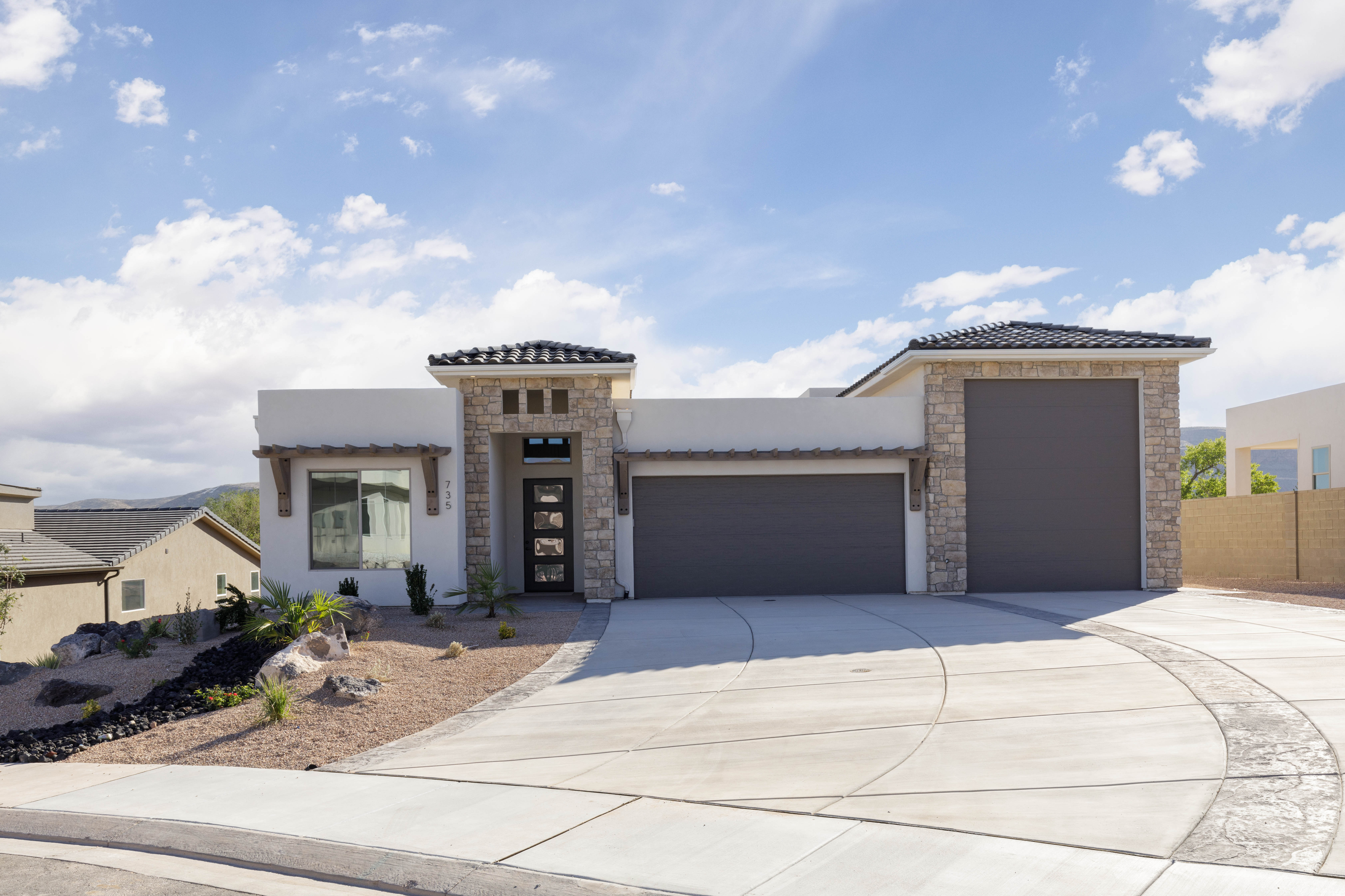 Street view of The Meridian modern home in Hurricane Utah highlighting front elevation and curb appeal.