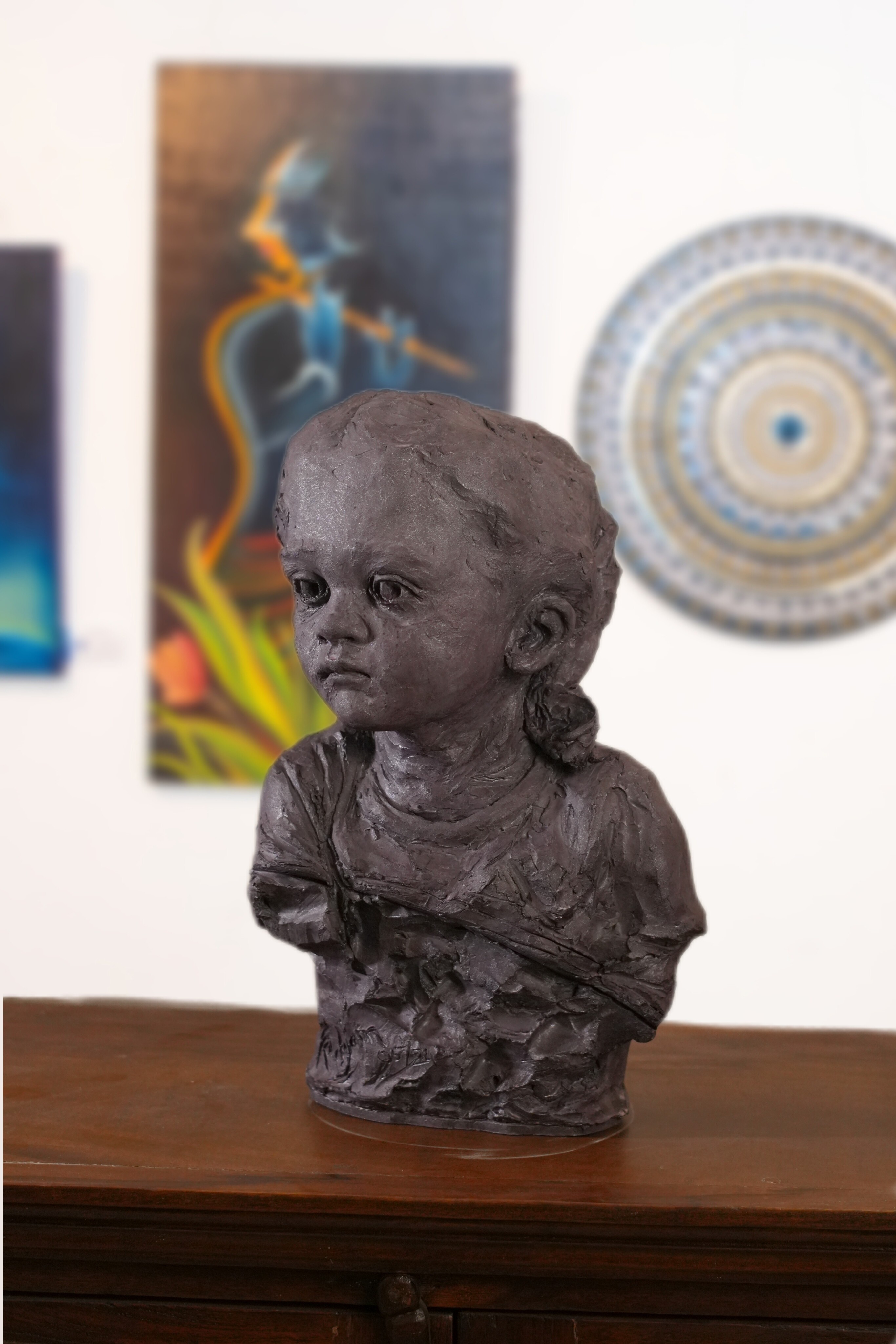 portrait sculpture of a young child