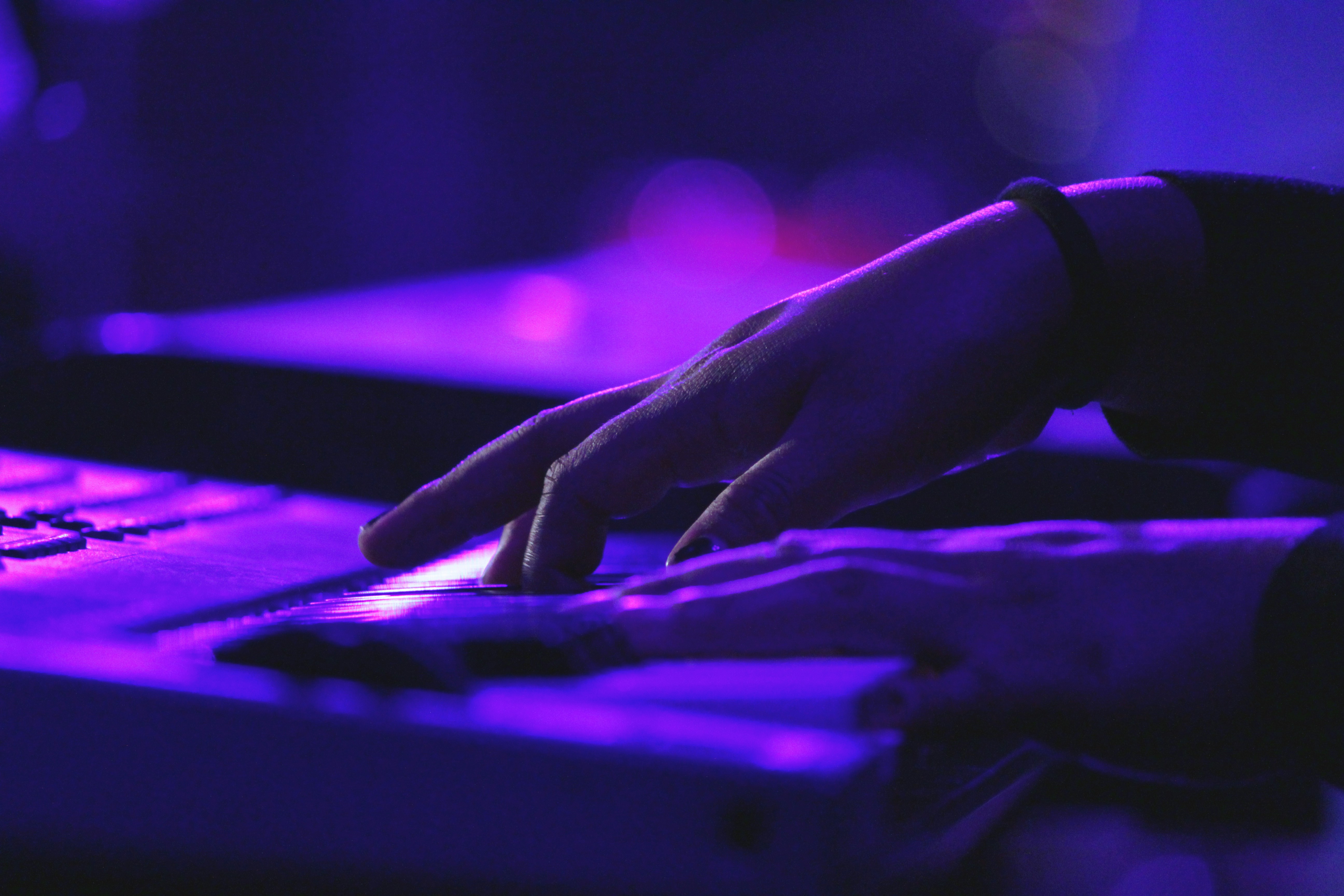 playing casio in purple light