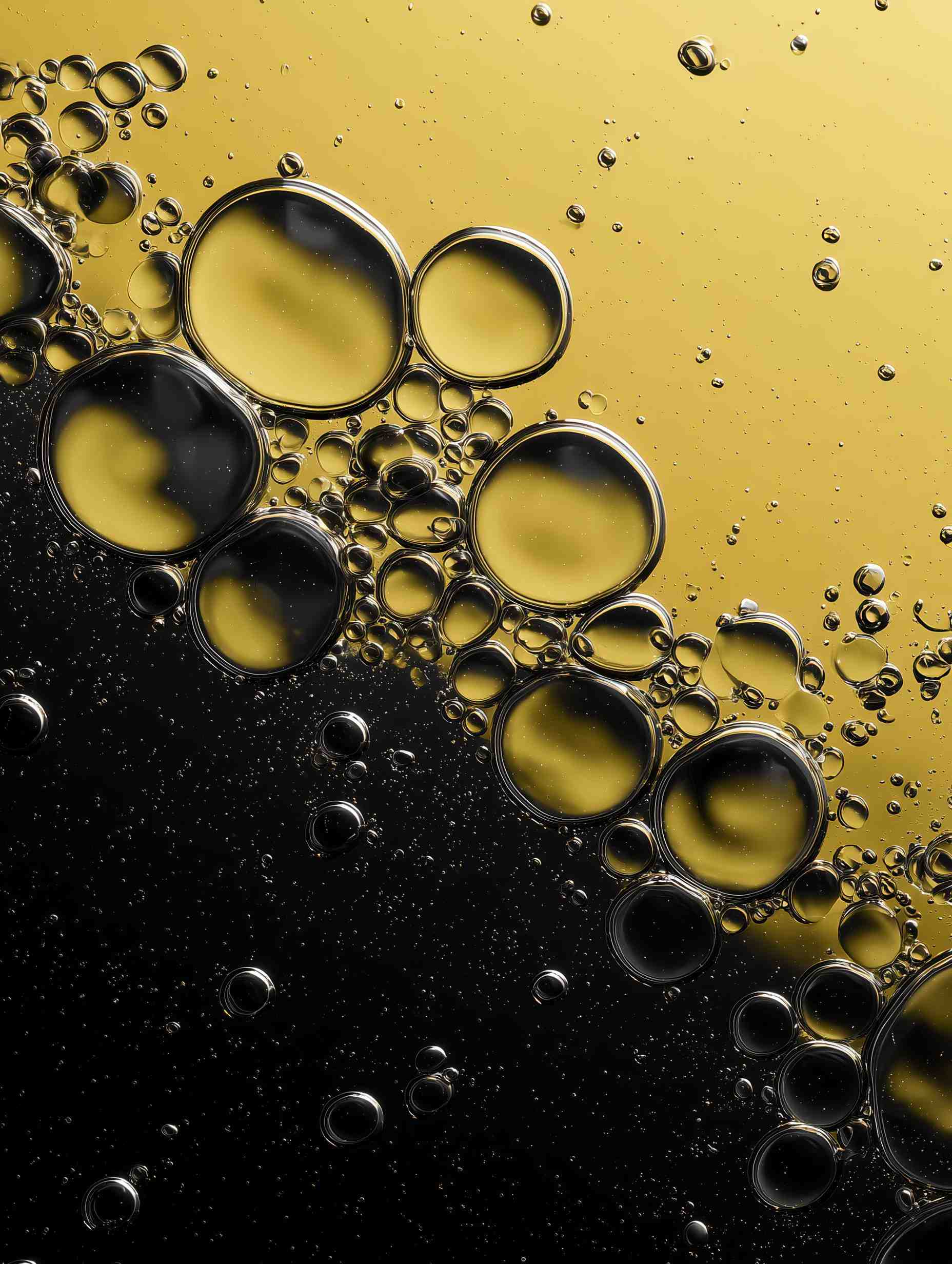 Golden bubbles of varying sizes with color gradients