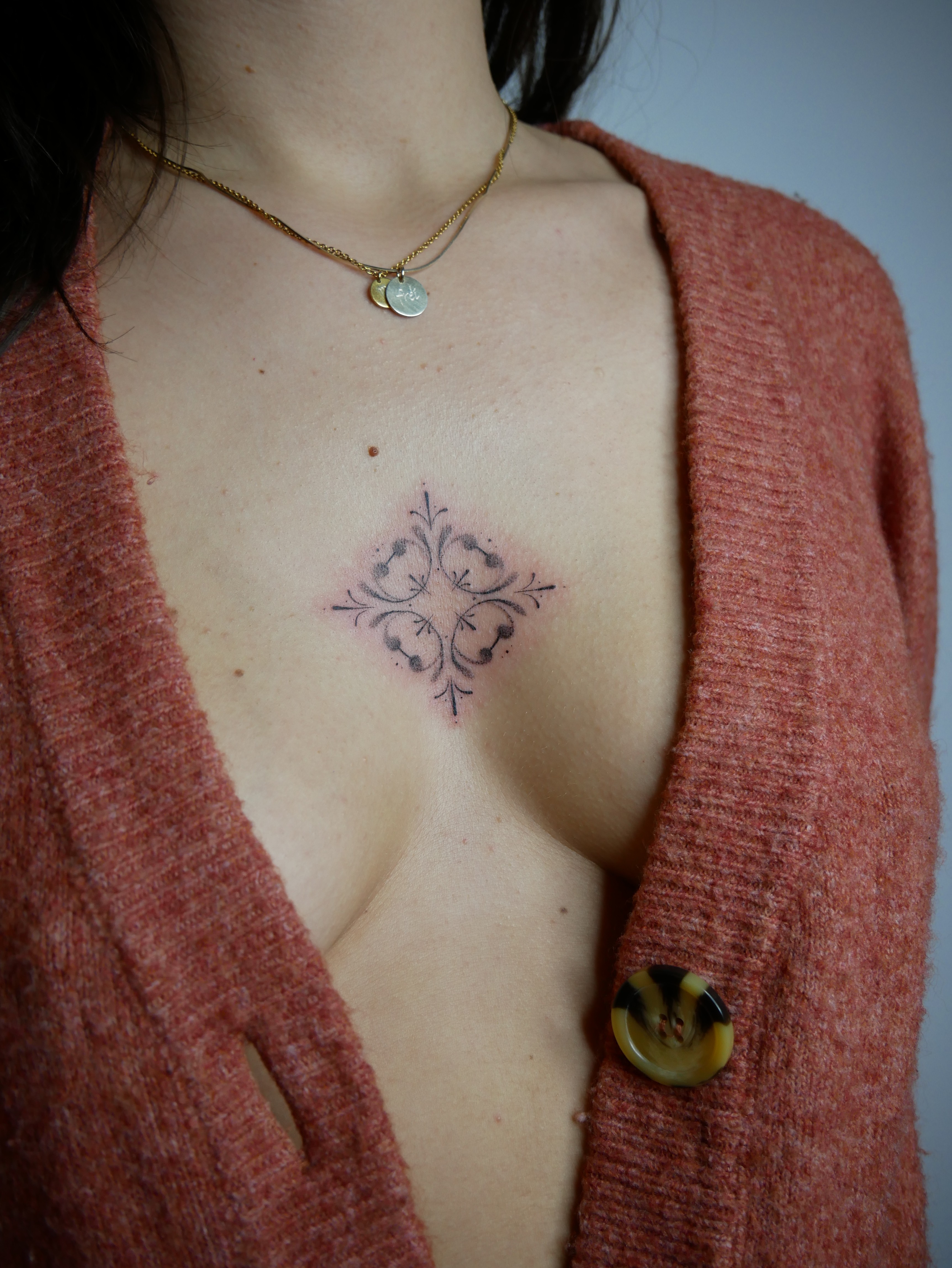 Fineline Handpoke Mandala Tattoo on sternum by Artist Chiara