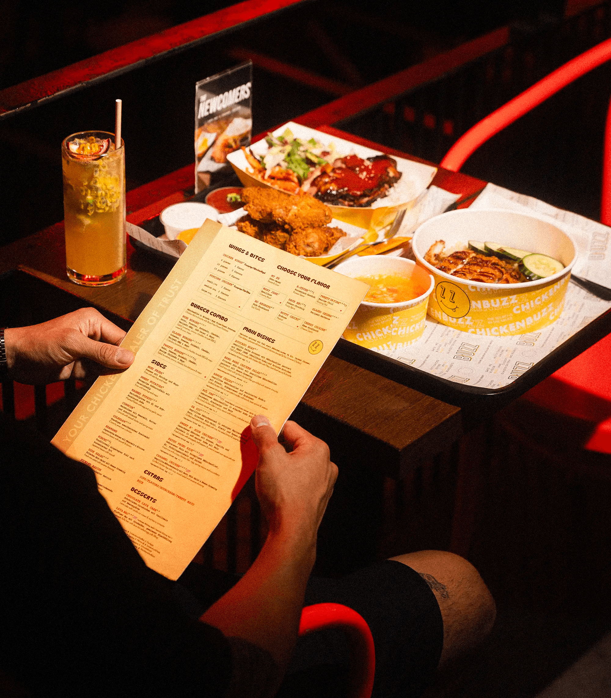 sitting at a table reading the menu
