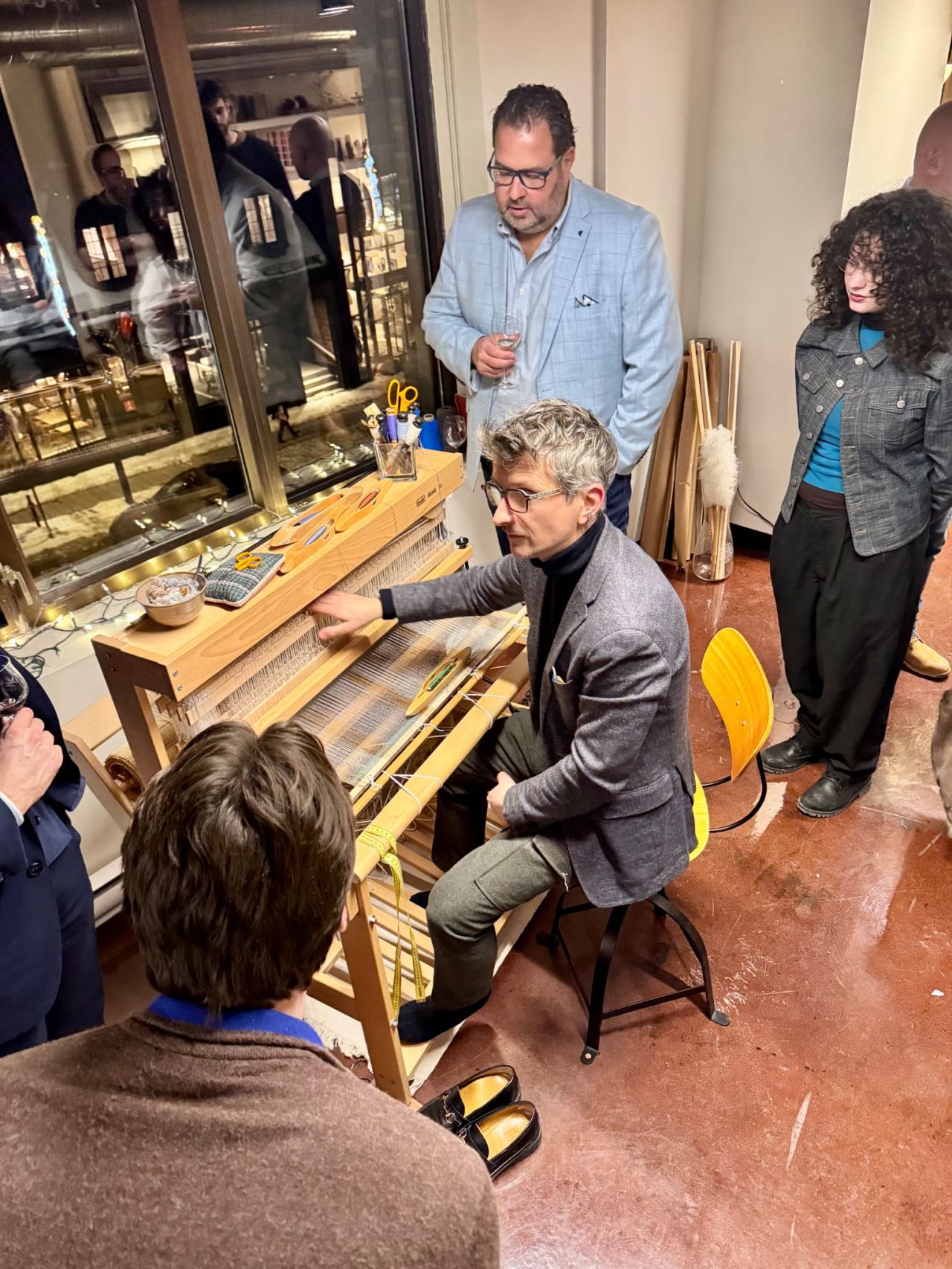 A disco ball hangs from a white ceiling.