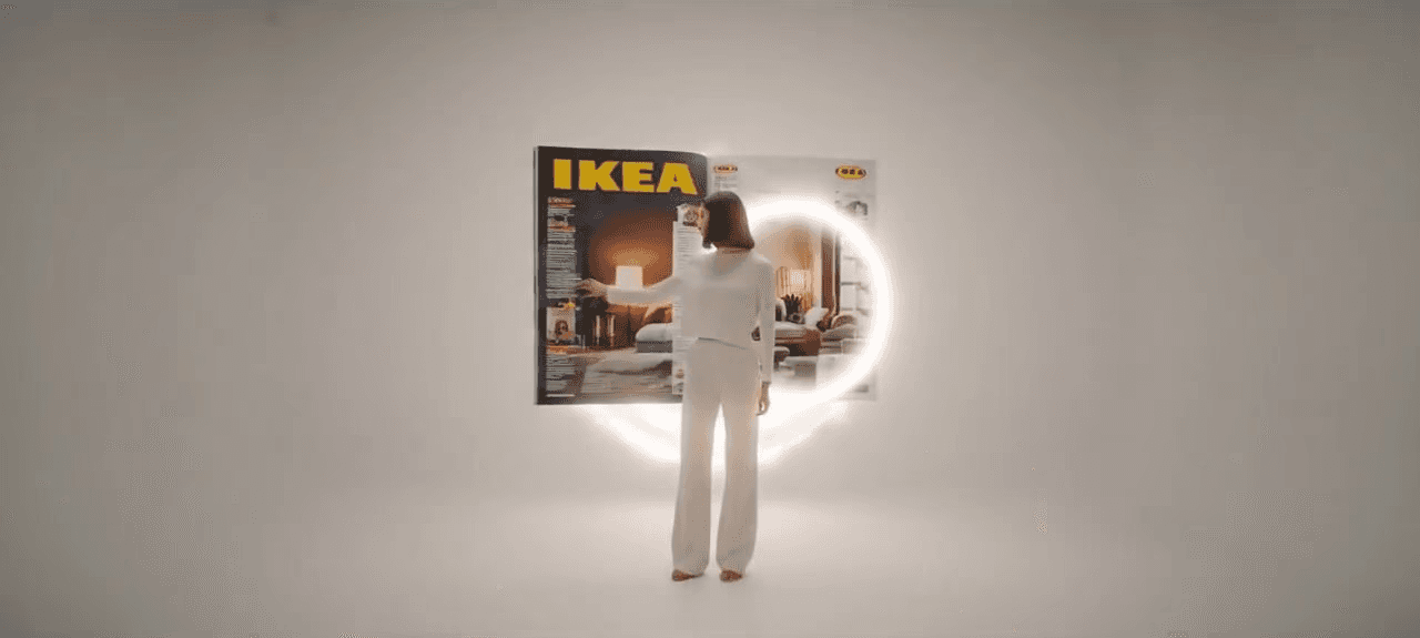A futuristic AI-generated IKEA video ad thumbnail by Mahendra R, featuring a woman in white standing in a bright studio in front of a large, floating IKEA catalog surrounded by a glowing white ring light.