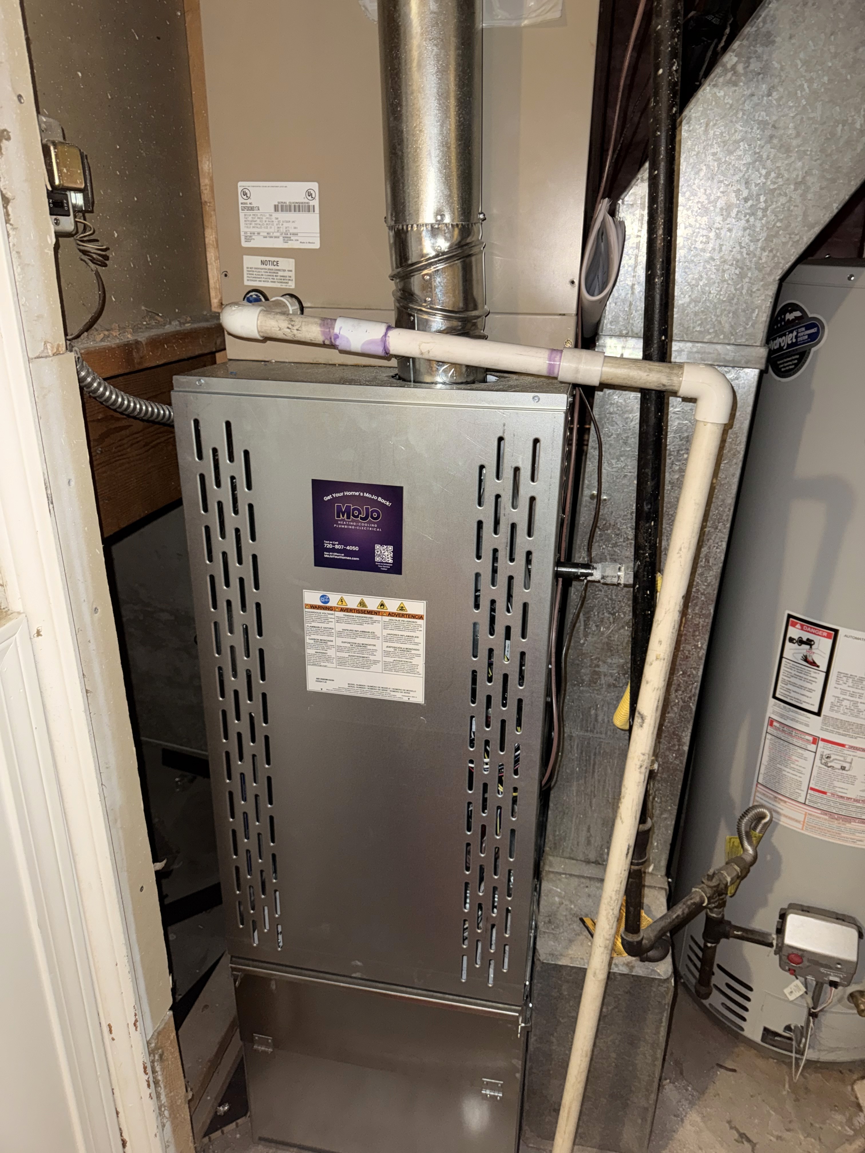 This image shows a gas furnace, which is a key component of a home's heating, ventilation, and air conditioning (HVAC) system.